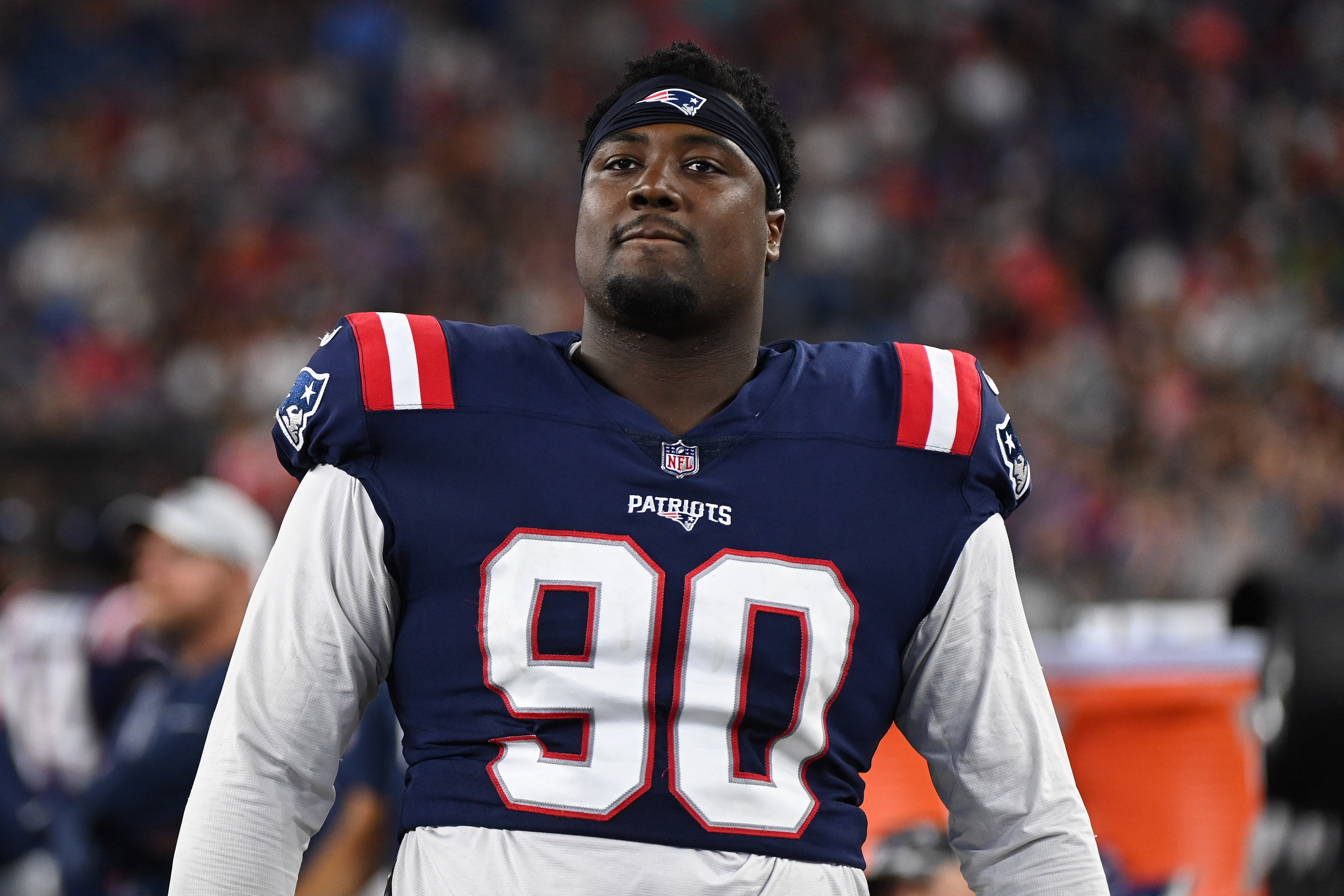 Aug 19, 2022; Foxborough, Massachusetts, USA; New England Patriots defensive tackle Christian Barmore (90) on the sidelines during the second half of a preseason game against the Carolina Panthers at Gillette Stadium.