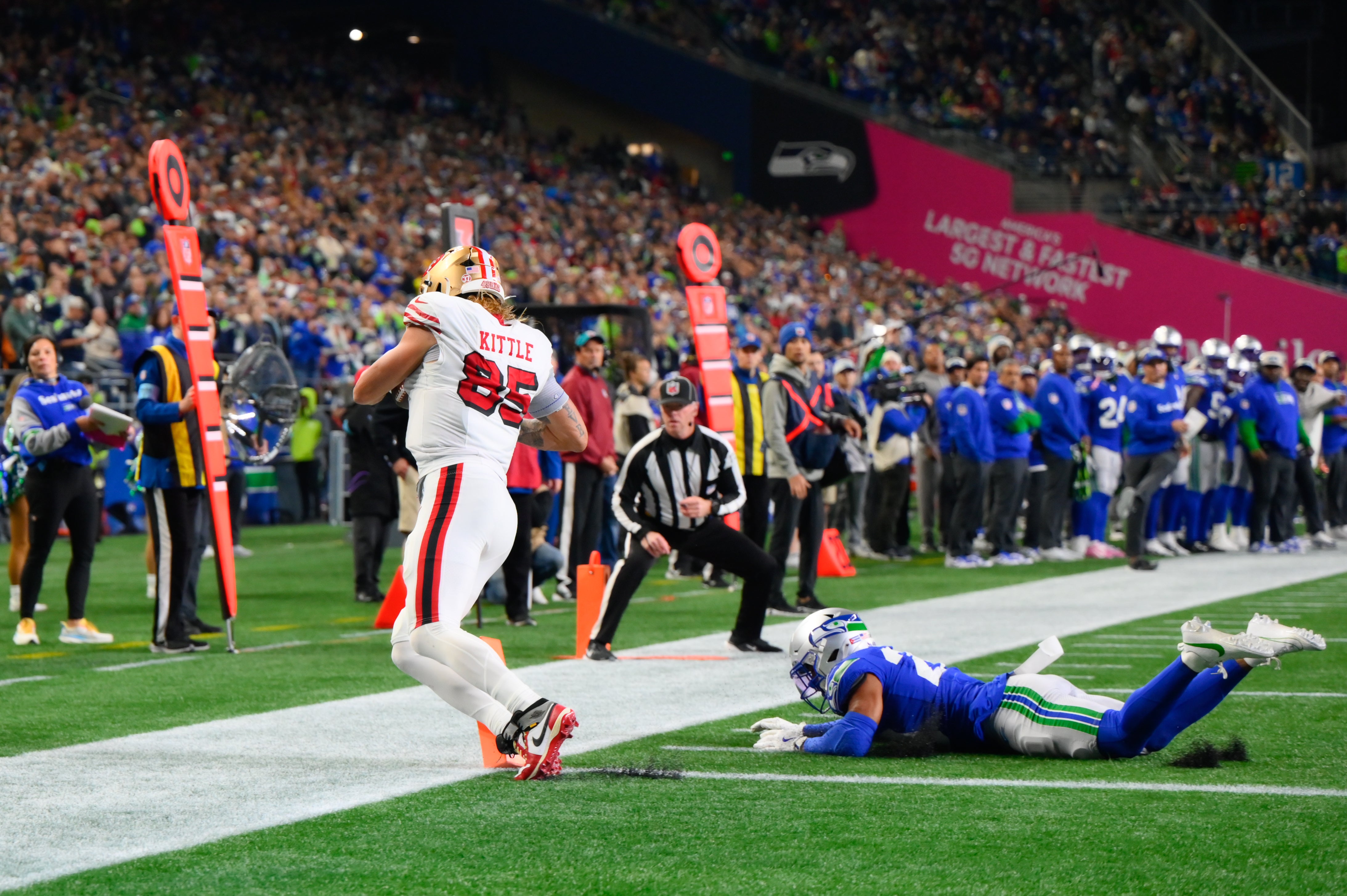 San Francisco 49ers tight end George Kittle (85) drags his toes for a touchdown against the Seattle Seahawks during the second half at Lumen Field.