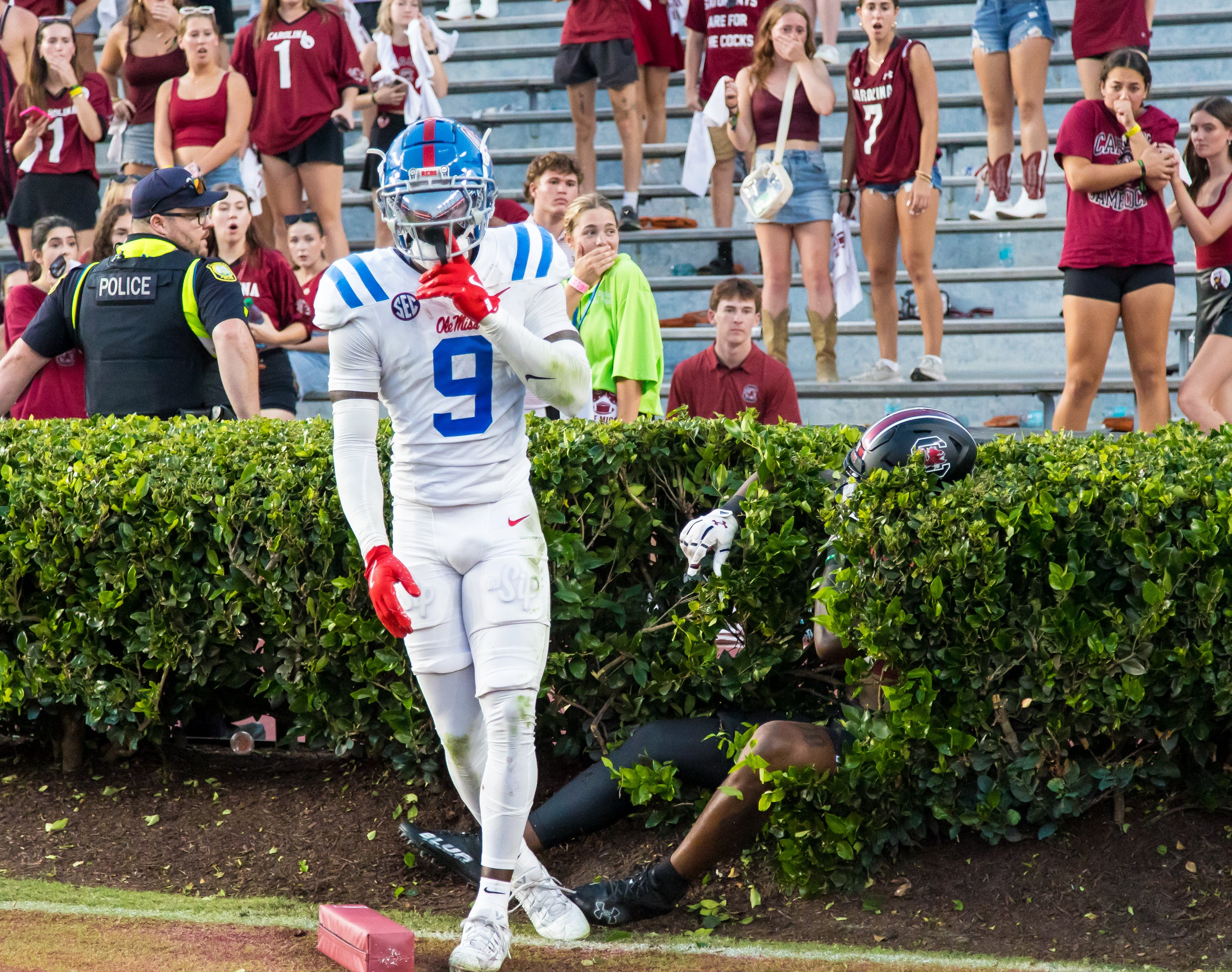 Oct 5, 2024; Columbia, South Carolina, USA; Mississippi Rebels wide receiver Tre Harris (9) celebrates knocking a pass away from South Carolina Gamecocks wide receiver Dalevon Campbell (15), in the hedge, in the second half at Williams-Brice Stadium.