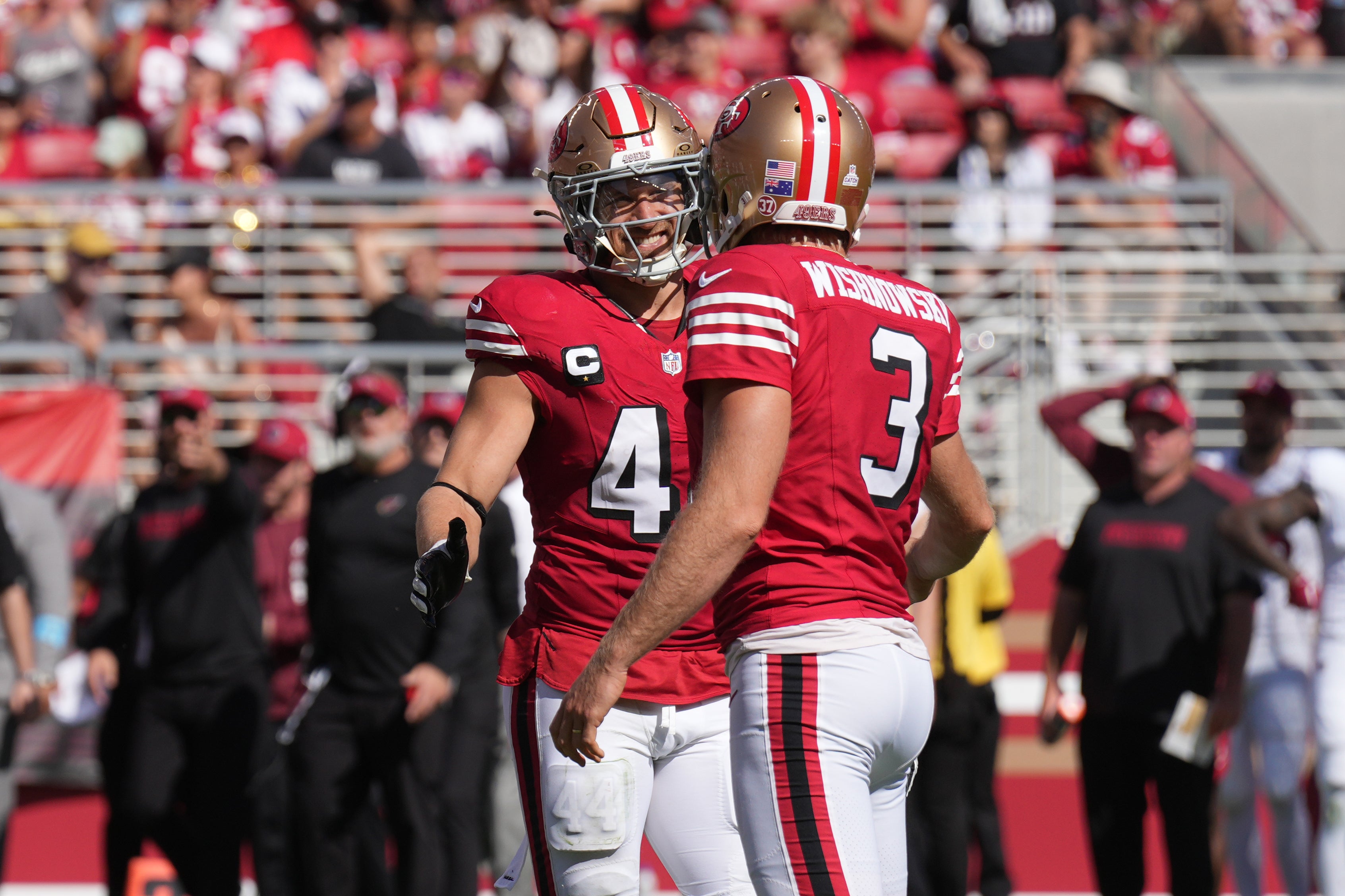 San Francisco 49ers punter Mitch Wishnowsky (3) is congratulated by fullback Kyle Juszczyk (left) after kicking a field goal against the Arizona Cardinals during the second quarter at Levi's Stadium.