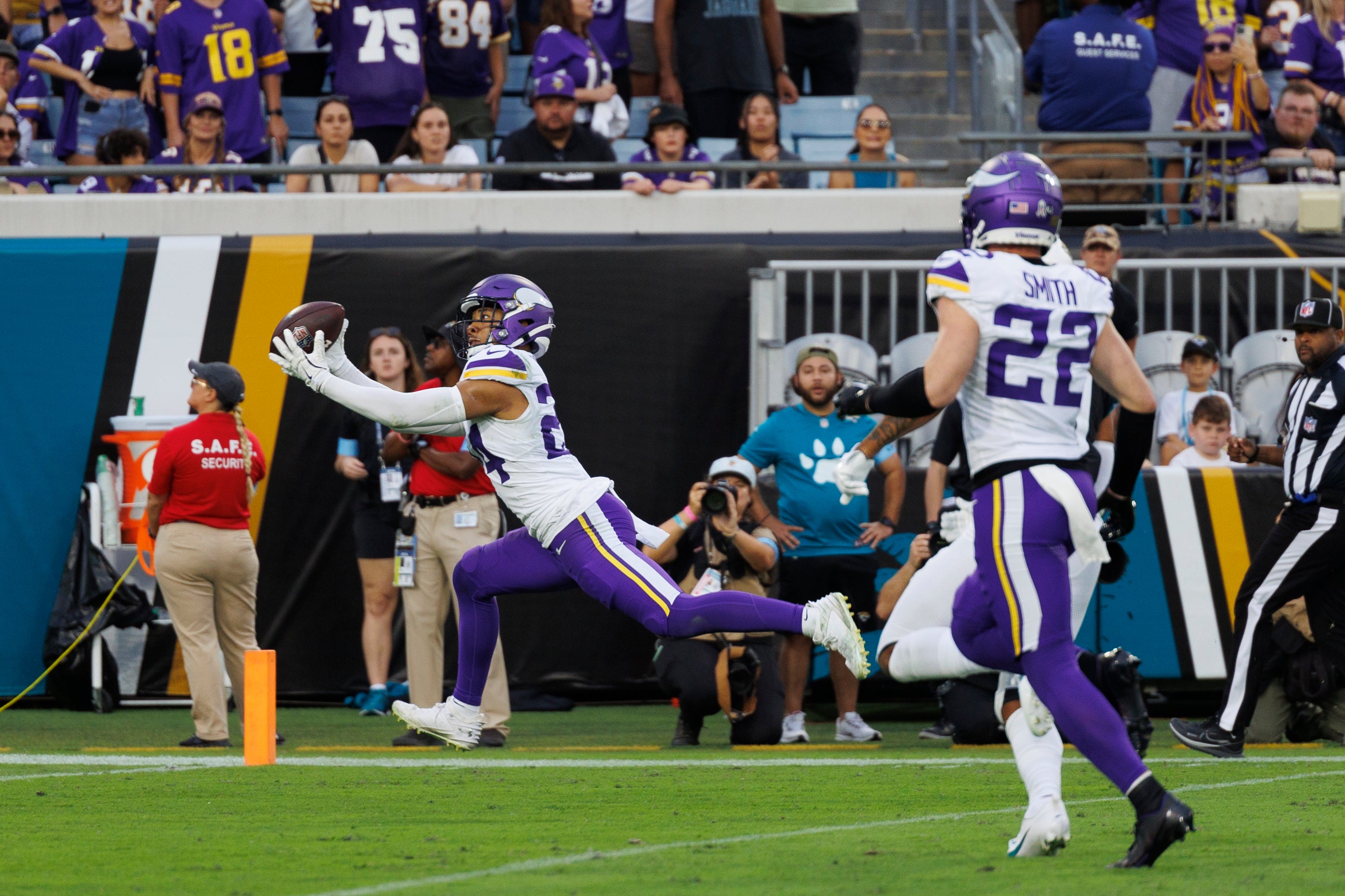 Nov 10, 2024; Jacksonville, Florida, USA; Minnesota Vikings safety Camryn Bynum (24) makes an interception against the Jacksonville Jaguars during the third quarter at EverBank Stadium.