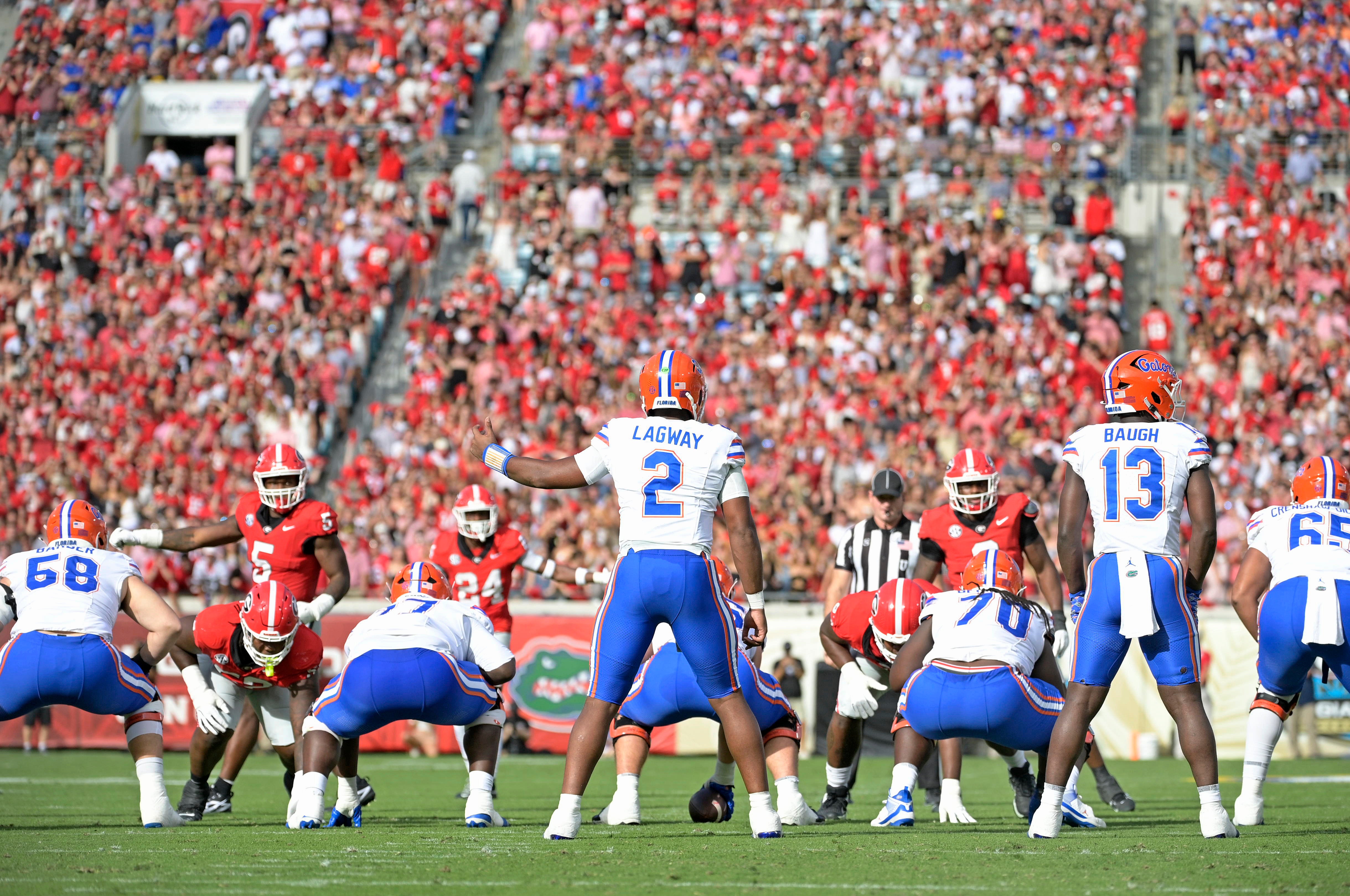 Florida Gators quarterback DJ Lagway (2) takes the snap against the Georgia Bulldogs during the first half at EverBank Stadium.