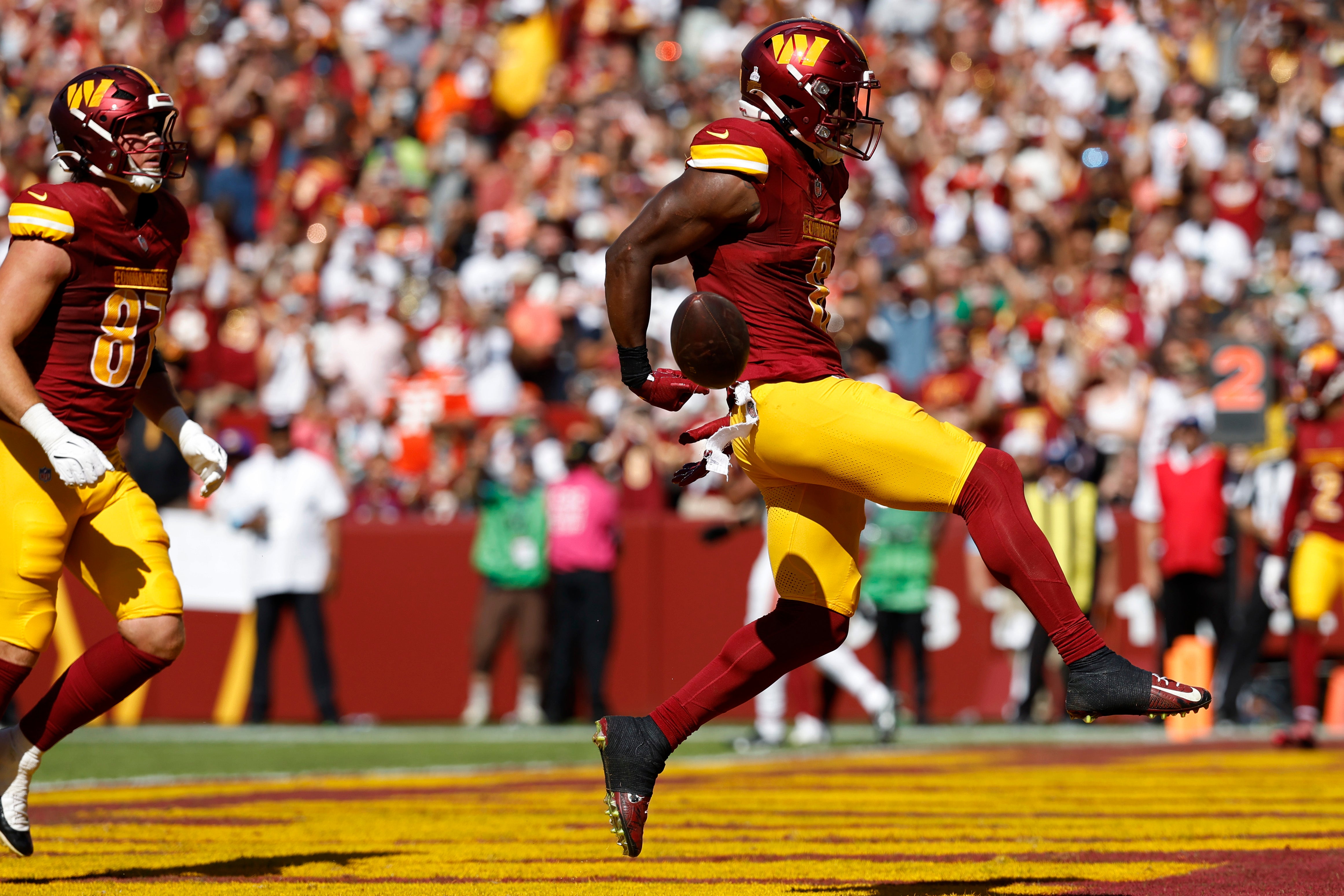 Oct 6, 2024; Landover, Maryland, USA; Washington Commanders running back Brian Robinson Jr. (8) celebrates after scoring a touchdown against the Cleveland Browns during the second quarter at NorthWest Stadium.