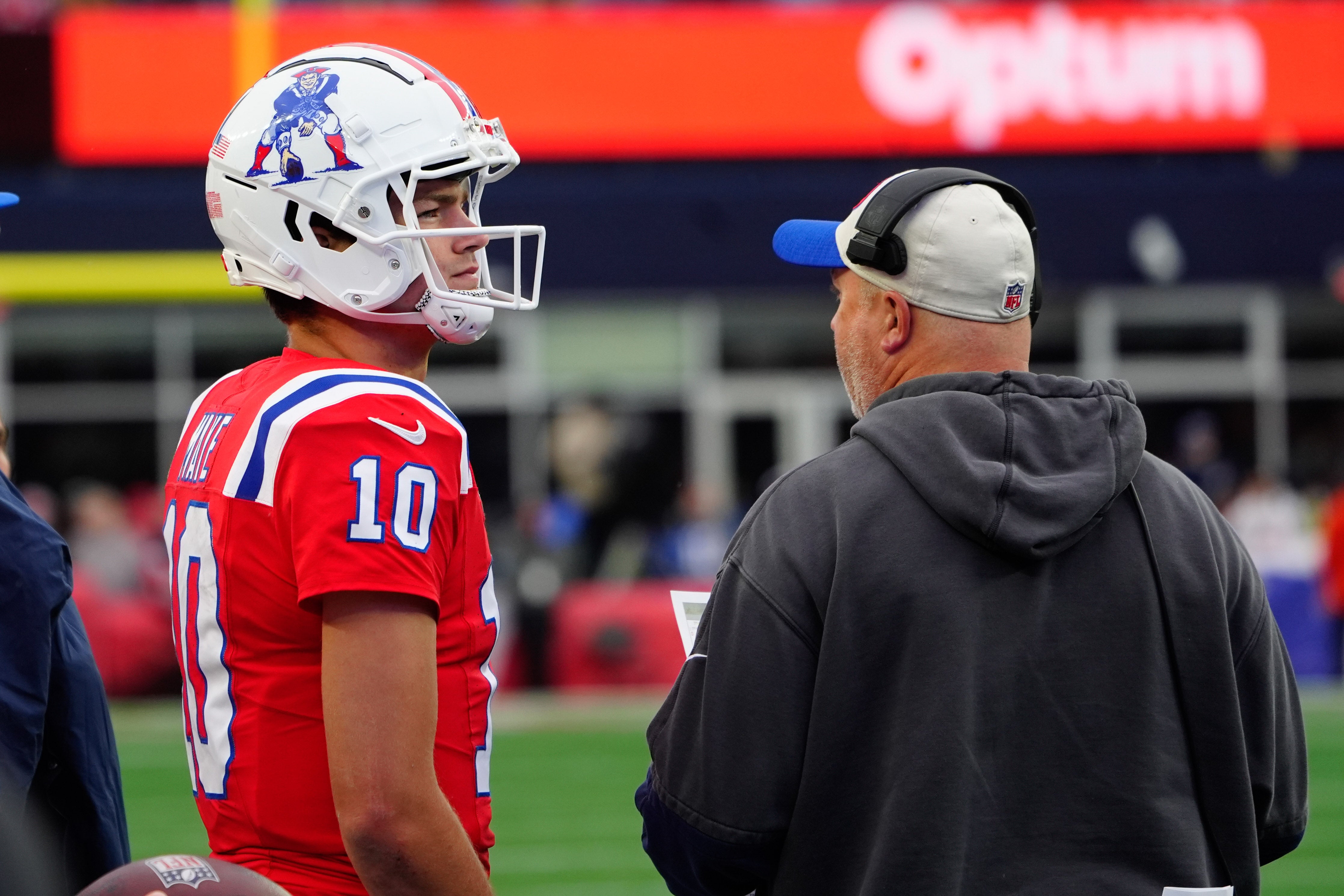 Oct 13, 2024; Foxborough, Massachusetts, USA; New England Patriots quarterback Drake Maye (10) on the sidelines with New England Patriots offensive coordinator Alex Van Pelt during the second half against the Houston Texans at Gillette Stadium.