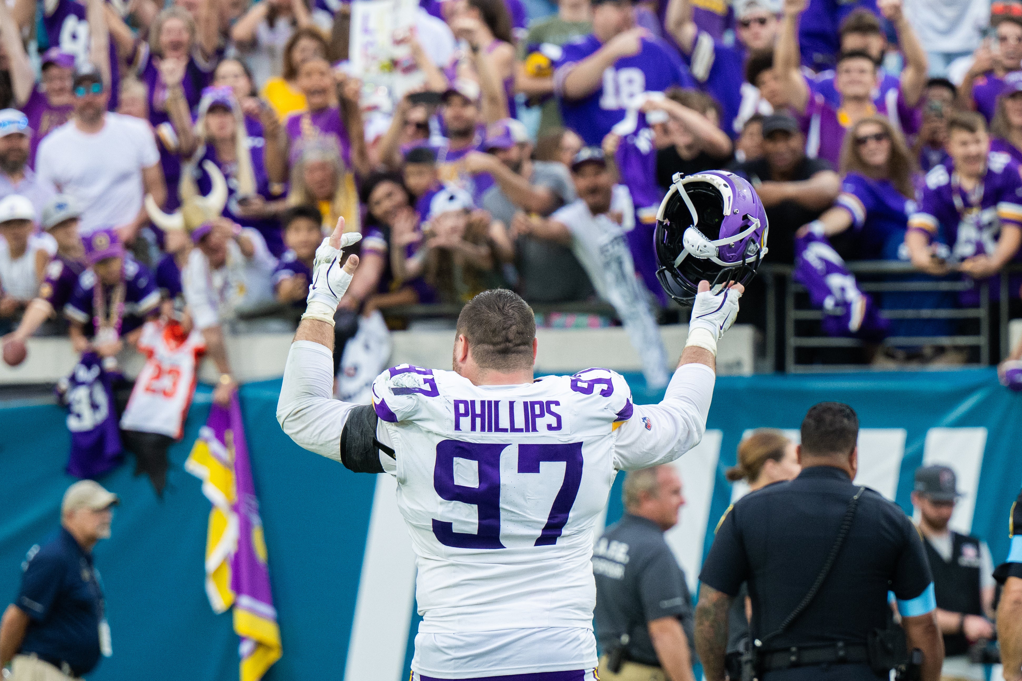 Nov 10, 2024; Jacksonville, Florida, USA; Minnesota Vikings defensive lineman Harrison Phillips (97) celebrates with the fans after the win against the Jacksonville Jaguars at EverBank Stadium.