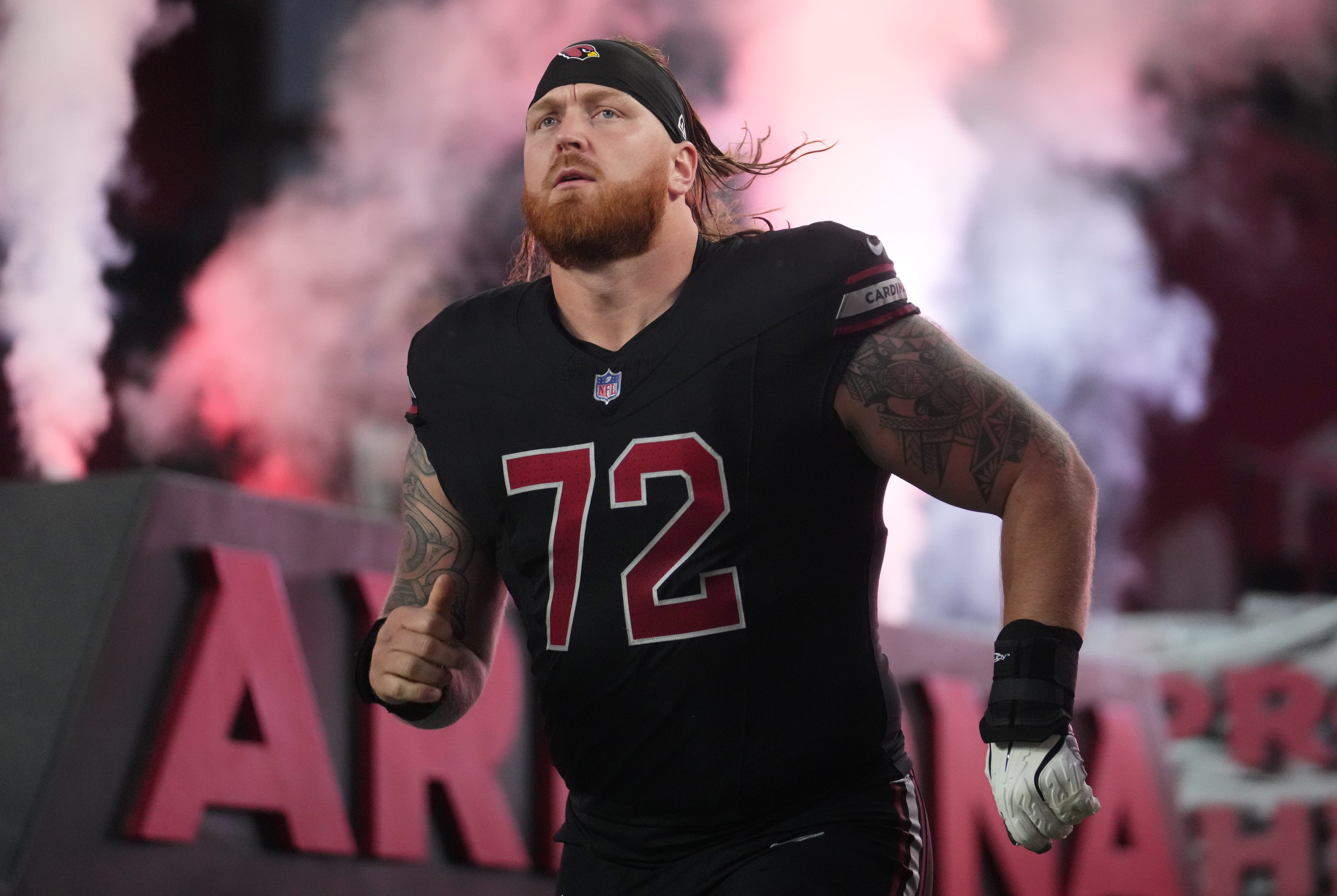 Arizona Cardinals offensive lineman Hjalte Froholdt (72) takes the field for their game against the Los Angeles Chargers at State Farm Stadium in Glendale on Oct. 21, 2024.  