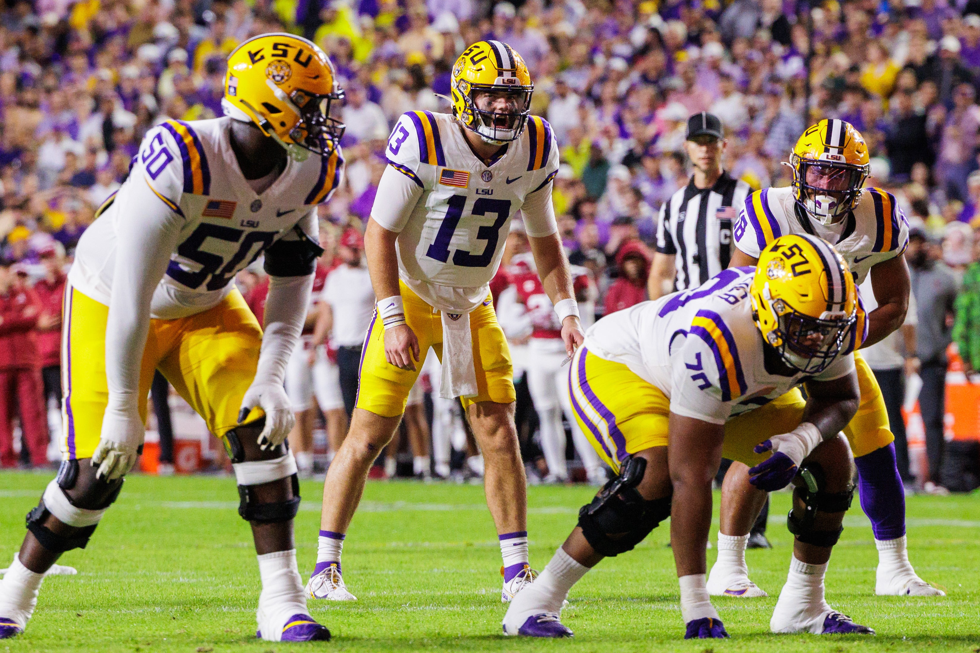Nov 9, 2024; Baton Rouge, Louisiana, USA; LSU Tigers quarterback Garrett Nussmeier (13) calls for the ball against the Alabama Crimson Tide at Tiger Stadium.