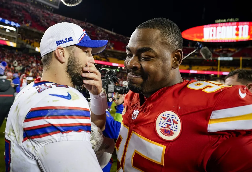 Buffalo Bills quarterback Josh Allen (17) greets Kansas City Chiefs defensive tackle Chris Jones (95) after a game at GEHA Field at Arrowhead Stadium.