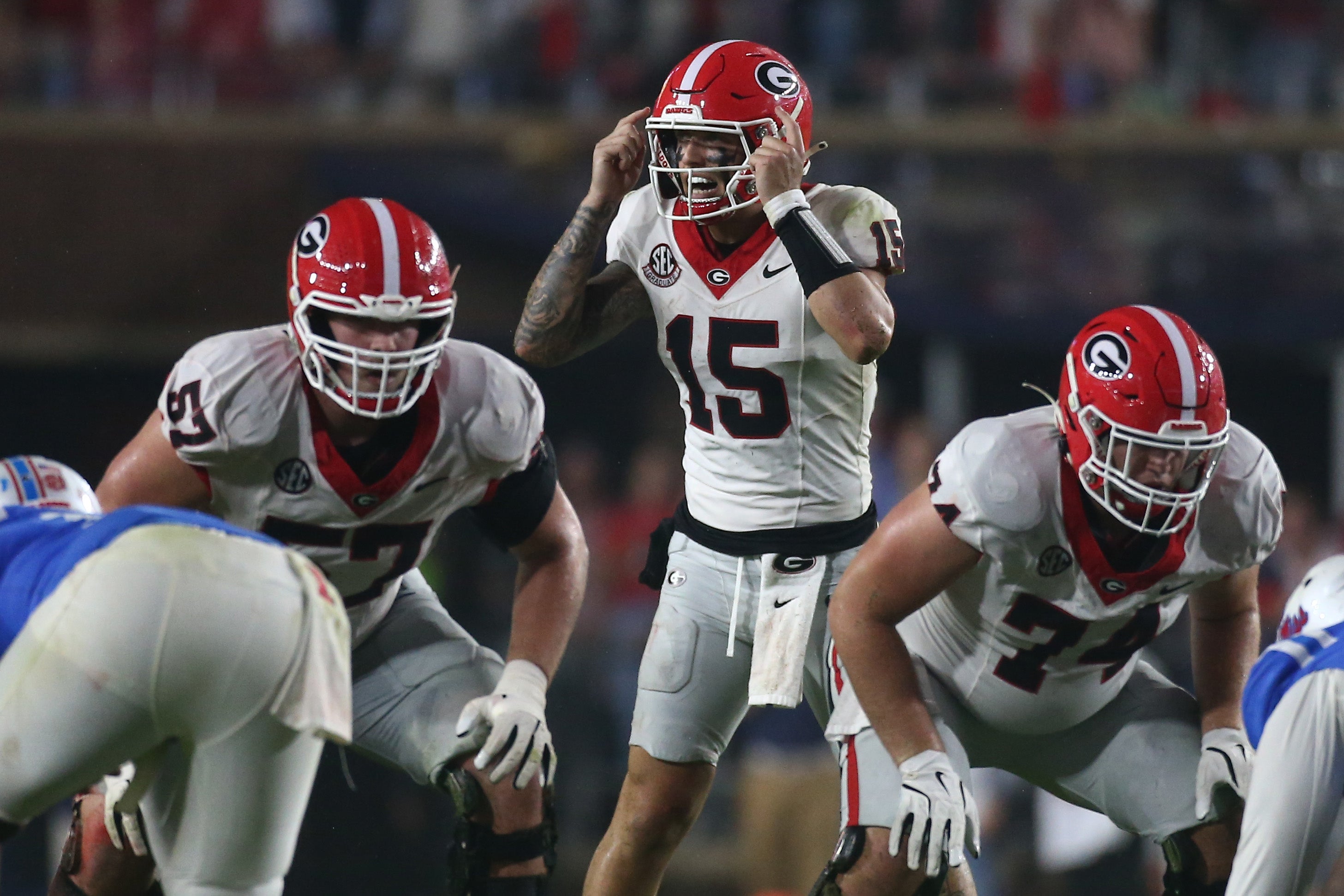 Georgia Bulldogs quarterback Carson Beck (15) gives direction before the snap during the second half against the Mississippi Rebels at Vaught-Hemingway Stadium.