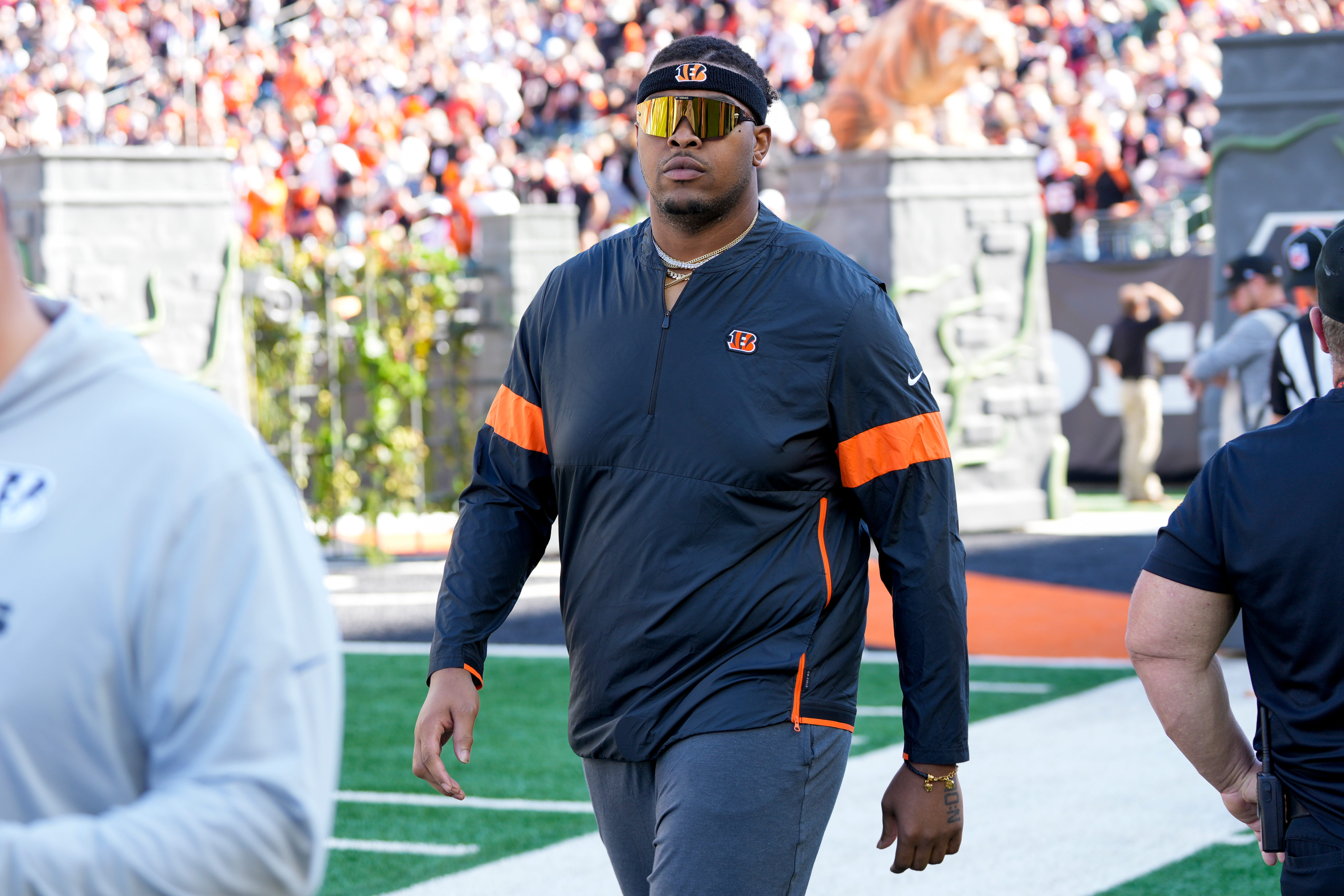 Orlando Brown Jr. walks on the field as he misses the game with an injury in the first quarter of the NFL Week 9 game between the Cincinnati Bengals and the Las Vegas Raiders at Paycor Stadium in downtown Cincinnati on Sunday, Nov. 3, 2024.