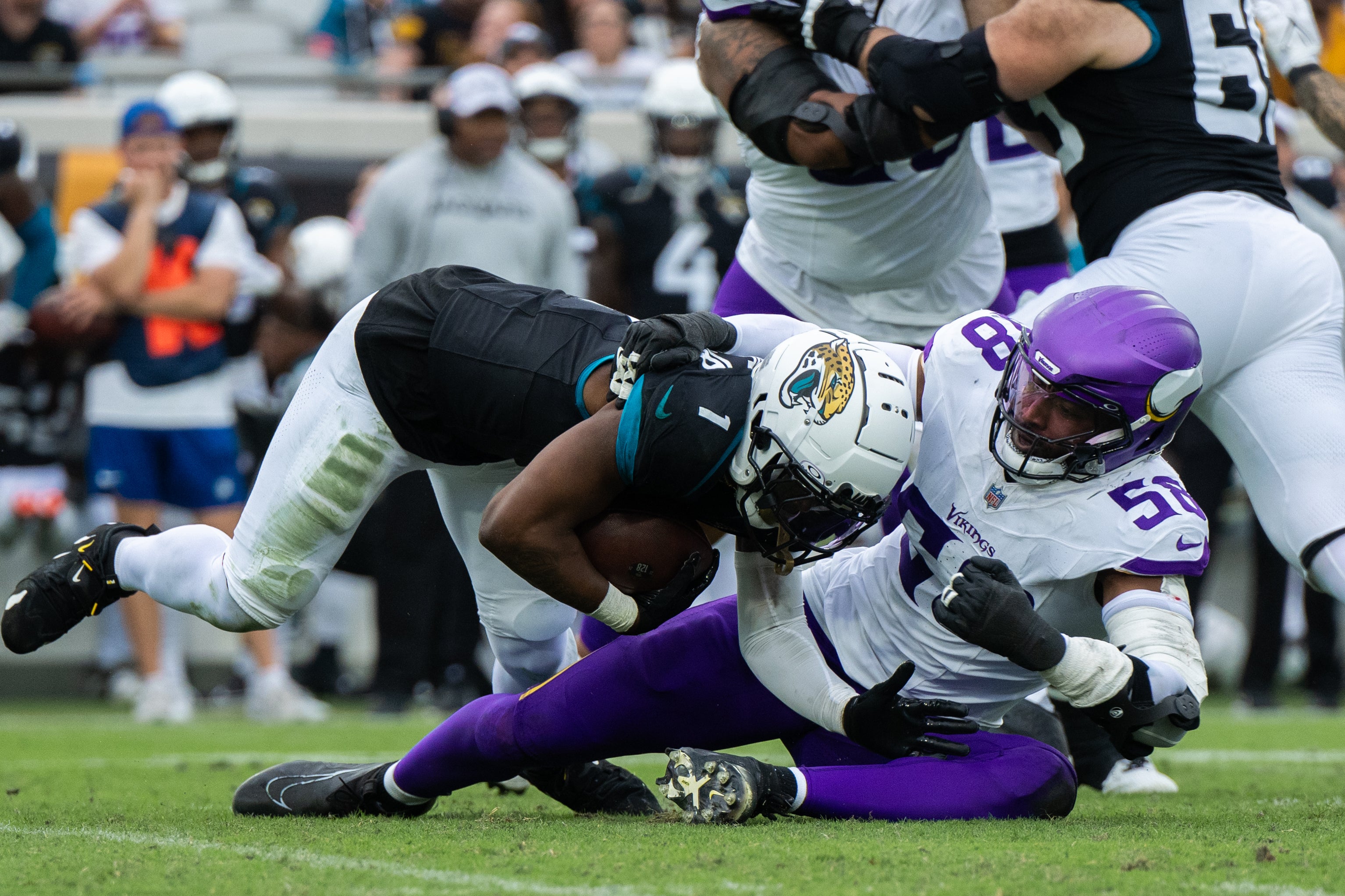 Nov 10, 2024; Jacksonville, Florida, USA; Minnesota Vikings linebacker Jonathan Greenard (58) tackles Jacksonville Jaguars running back Travis Etienne Jr (1) for a loss in the fourth quarter at EverBank Stadium.