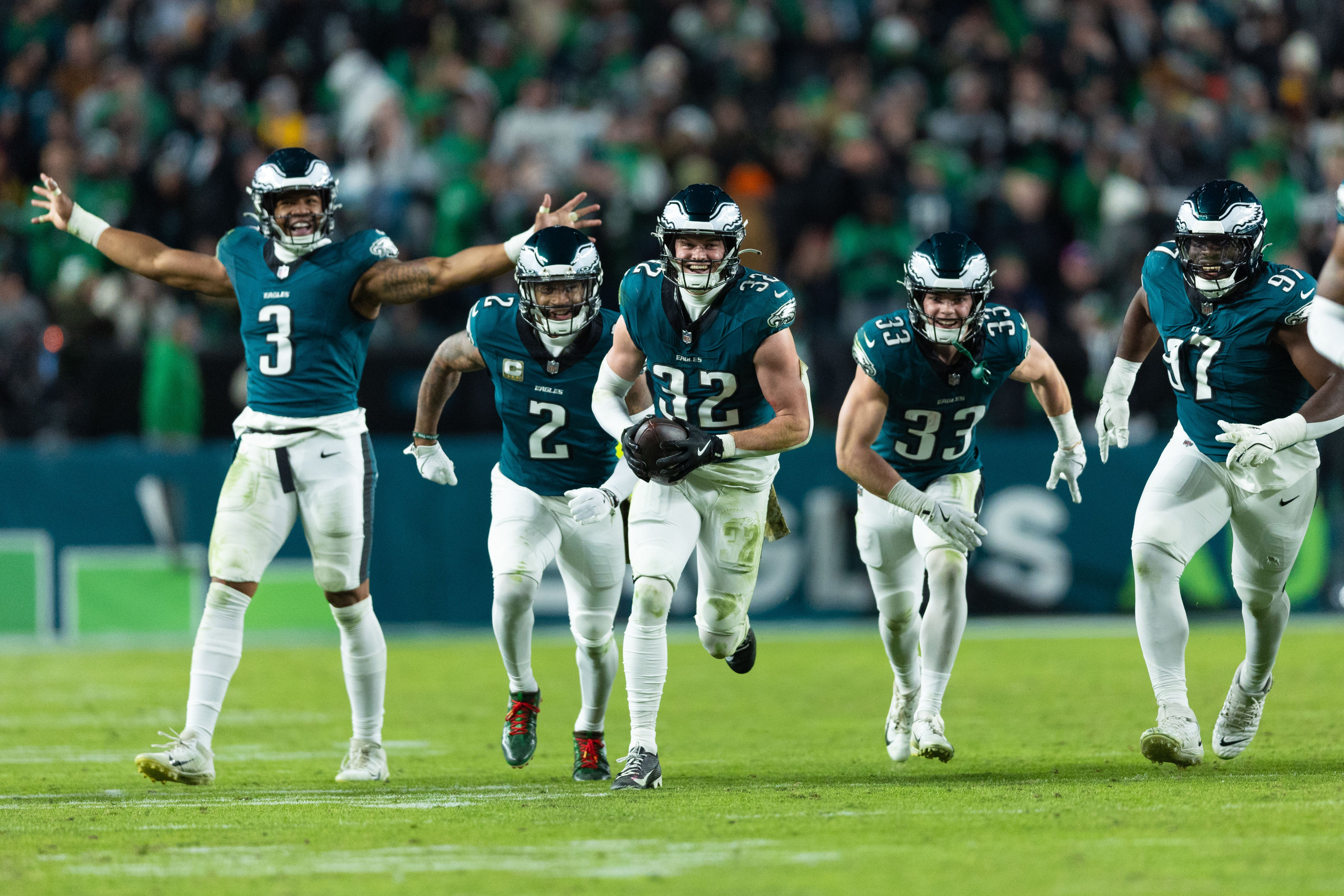 Philadelphia Eagles safety Reed Blankenship (32) celebrates with teammates after his interception during the fourth quarter against the Washington Commanders at Lincoln Financial Field.