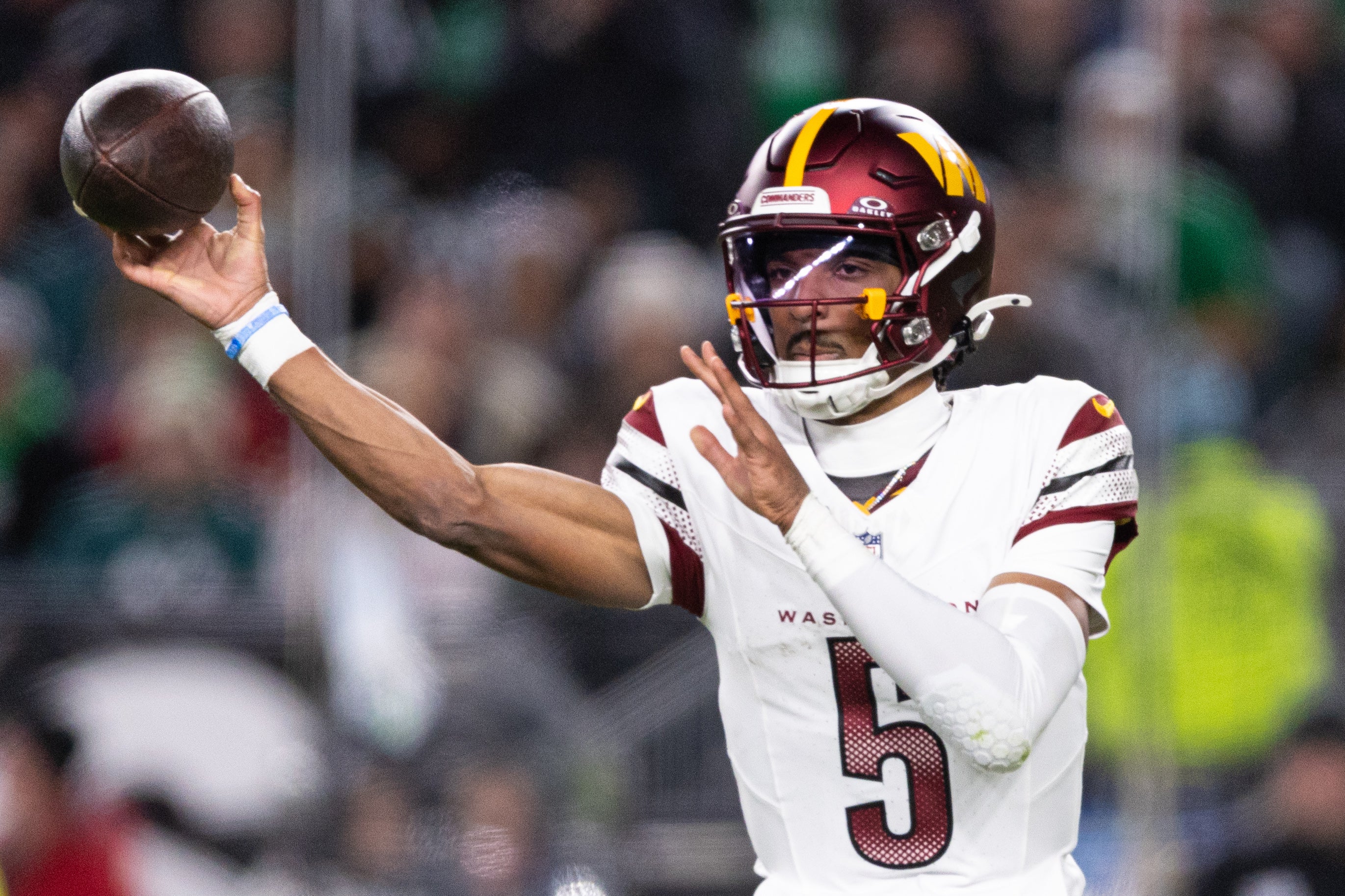 Nov 14, 2024; Philadelphia, Pennsylvania, USA; Washington Commanders quarterback Jayden Daniels (5) throws the ball against the Philadelphia Eagles during the second quarter at Lincoln Financial Field.