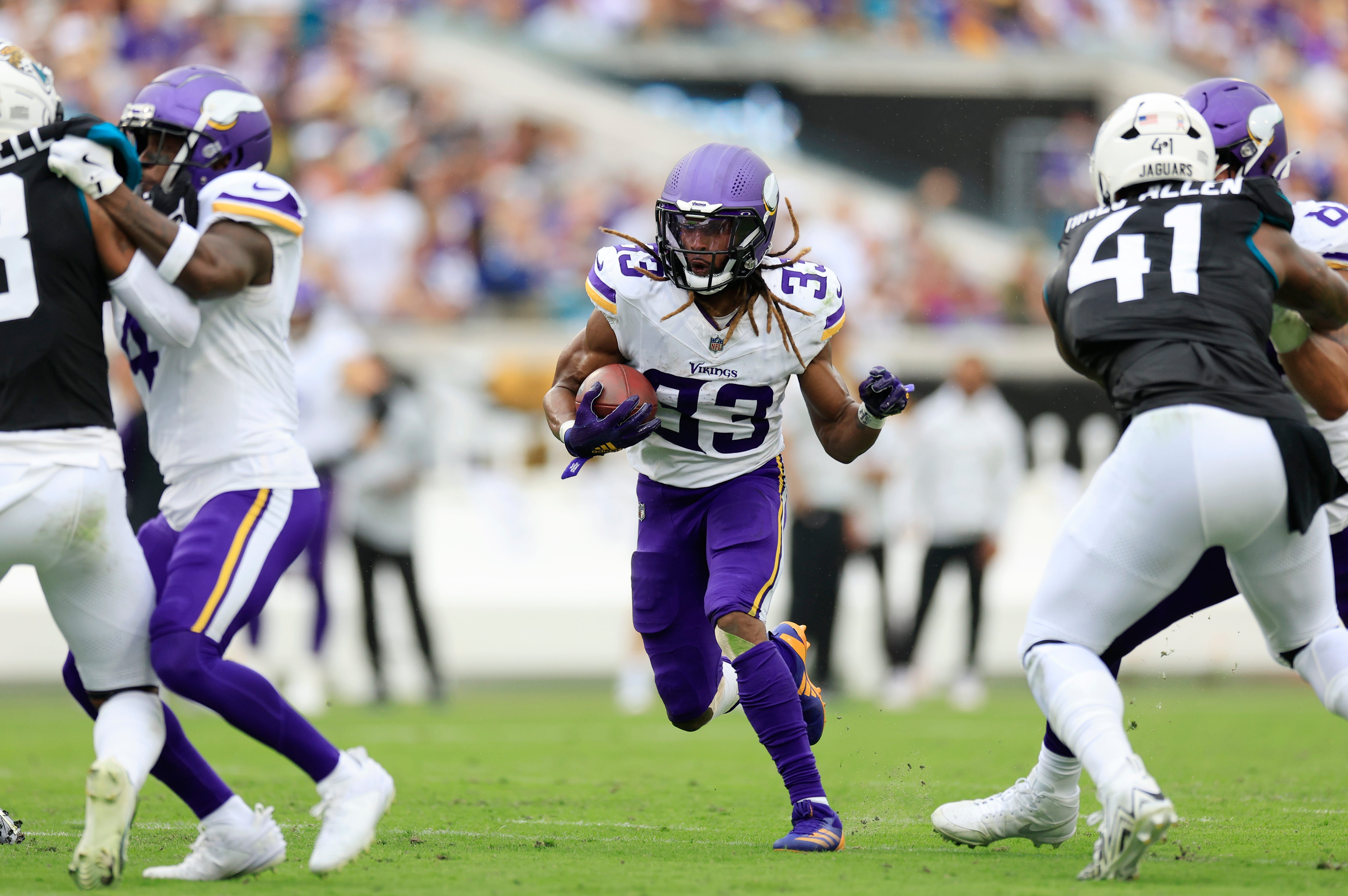 Minnesota Vikings running back Aaron Jones (33) finds a lane during the second quarter an NFL football matchup Sunday, Nov. 10, 2024 at Everbank Stadium in Jacksonville, Fla. The Vikings defeated the Jaguars 12-7.
