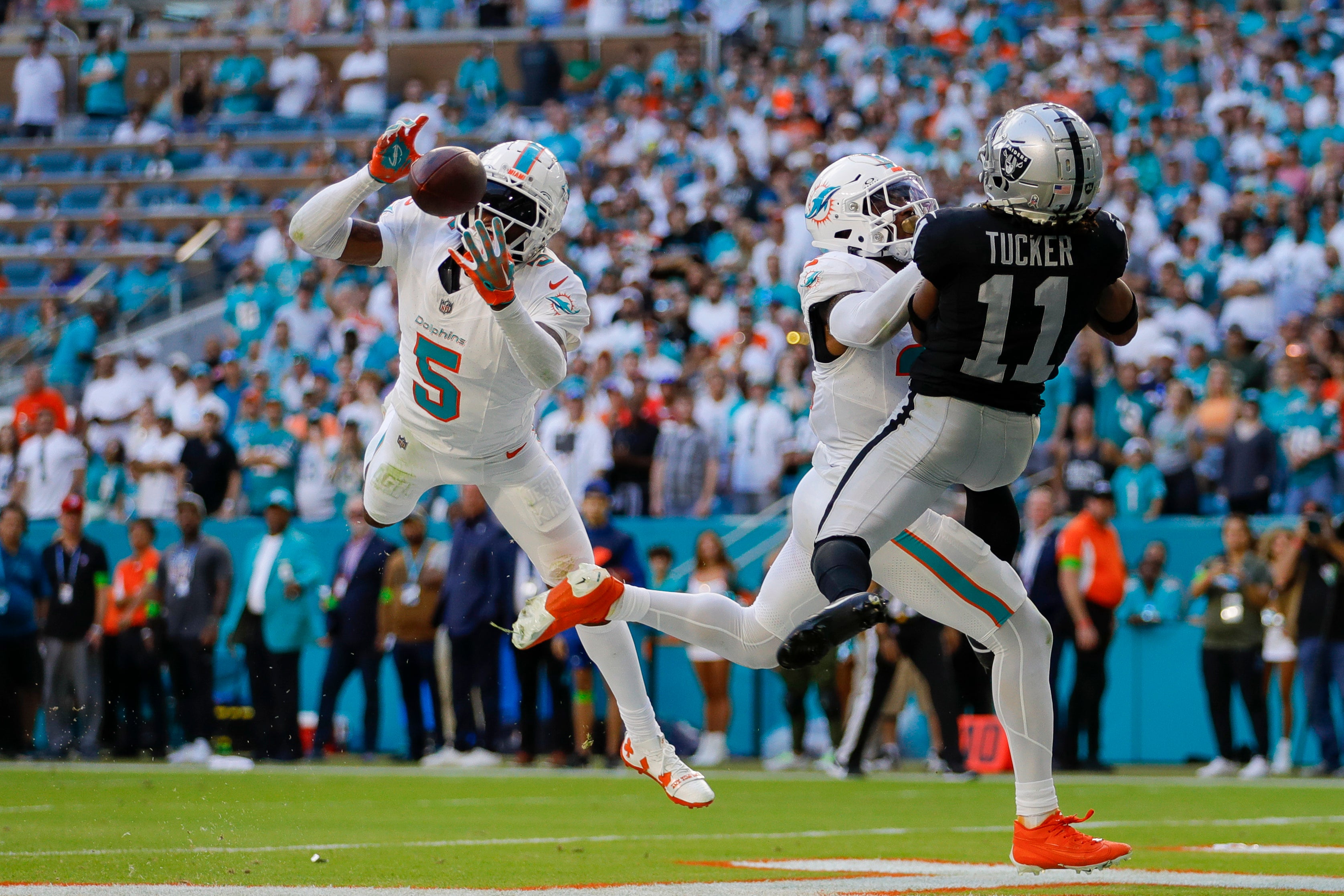 Nov 19, 2023; Miami Gardens, Florida, USA; Miami Dolphins cornerback Jalen Ramsey (5) intercepts a pass intended to Las Vegas Raiders wide receiver Tre Tucker (11) during the fourth quarter at Hard Rock Stadium.