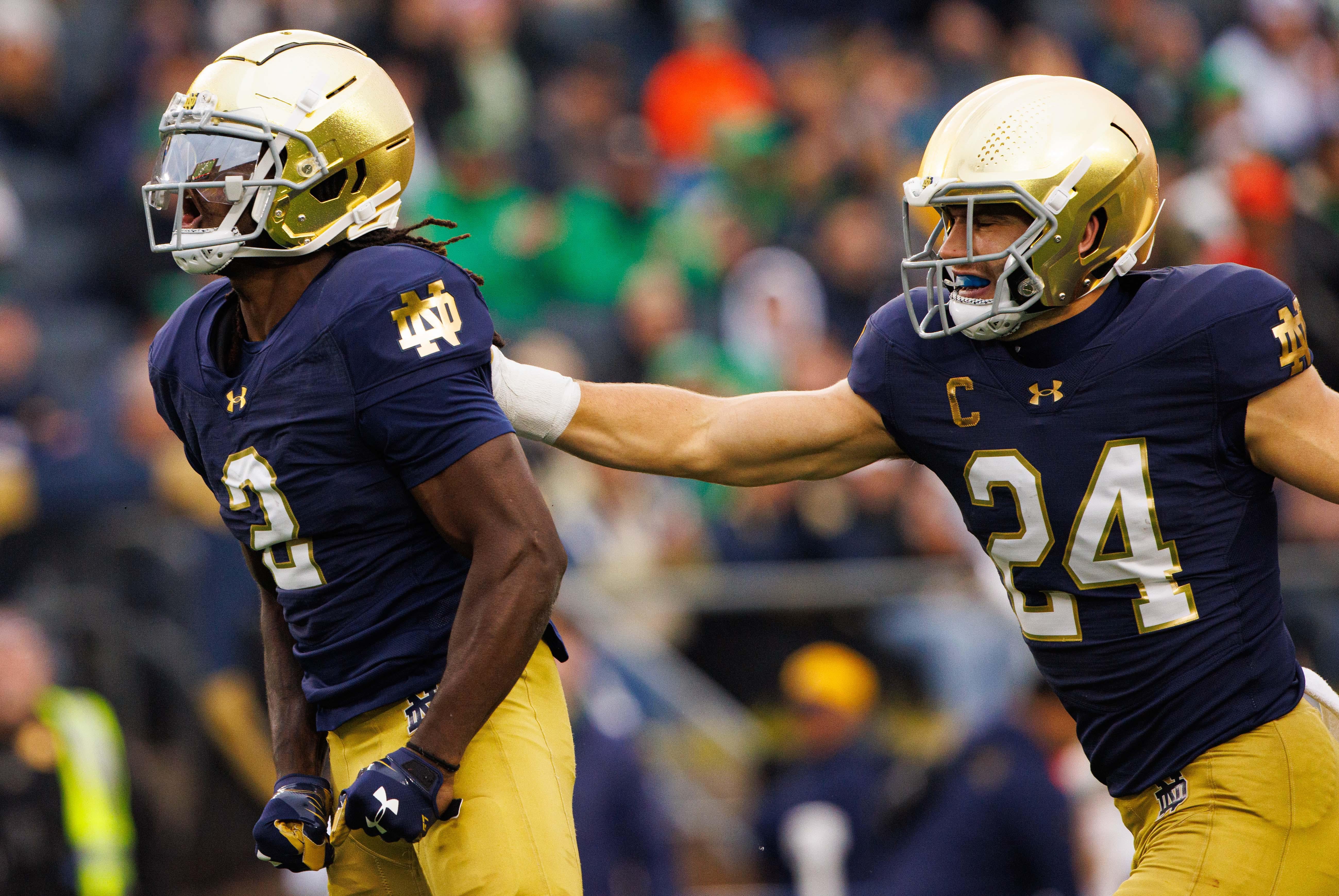 Notre Dame safety Rod Heard II (2) and linebacker Jack Kiser (24) celebrate a tackle by Heard during a NCAA college football game against Virginia at Notre Dame Stadium on Saturday, Nov. 16, 2024, in South Bend.