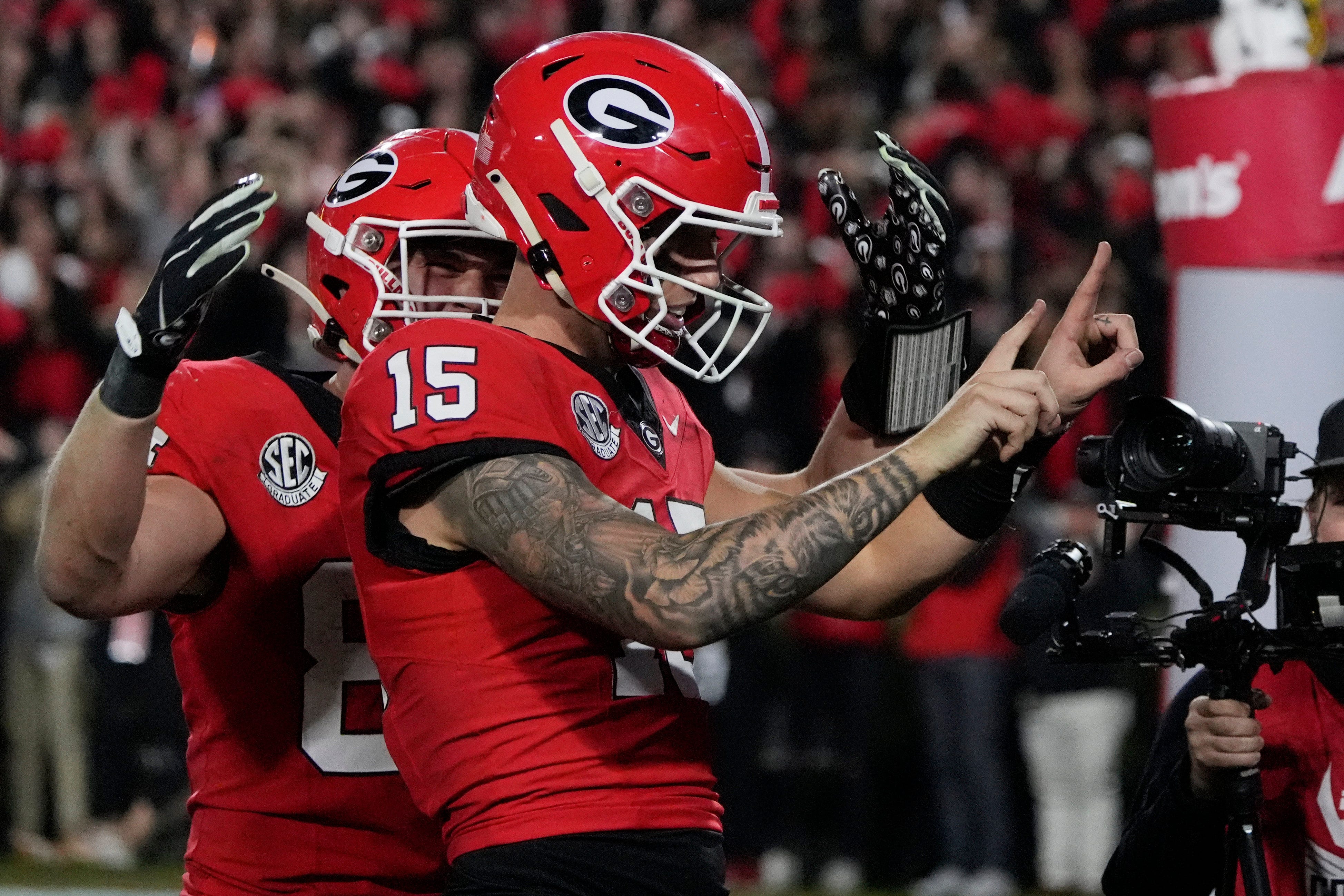 Georgia quarterback Carson Beck (15) celebrates with his teammates after scoring touchdown during the second half of a NCAA college football game against Tennessee in Athens, Ga., on Saturday, Nov. 16, 2024.
