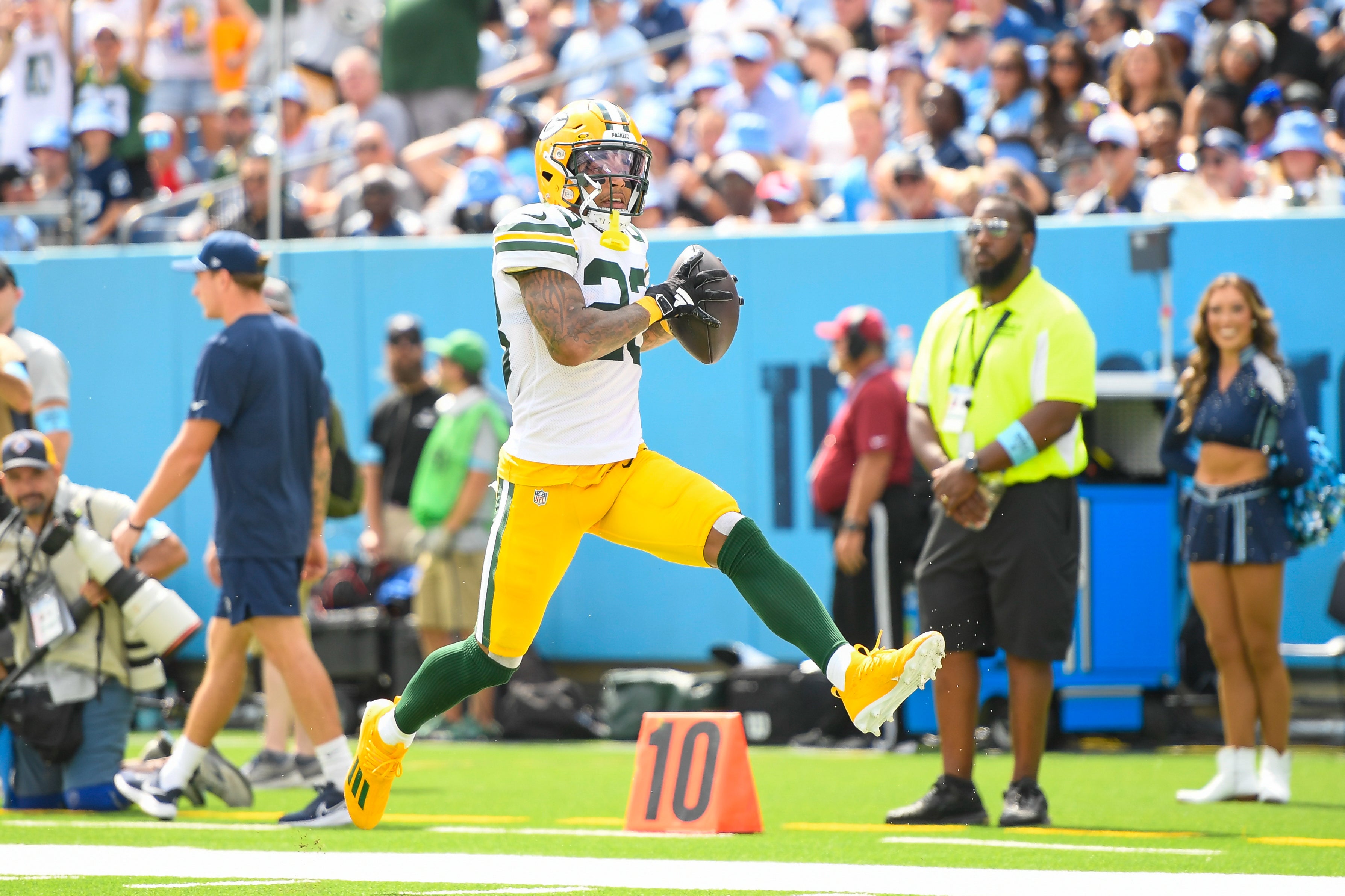 Green Bay Packers cornerback Jaire Alexander (23) scores on a pick six thrown by Tennessee Titans Will Levis (8) during the first half at Nissan Stadium.