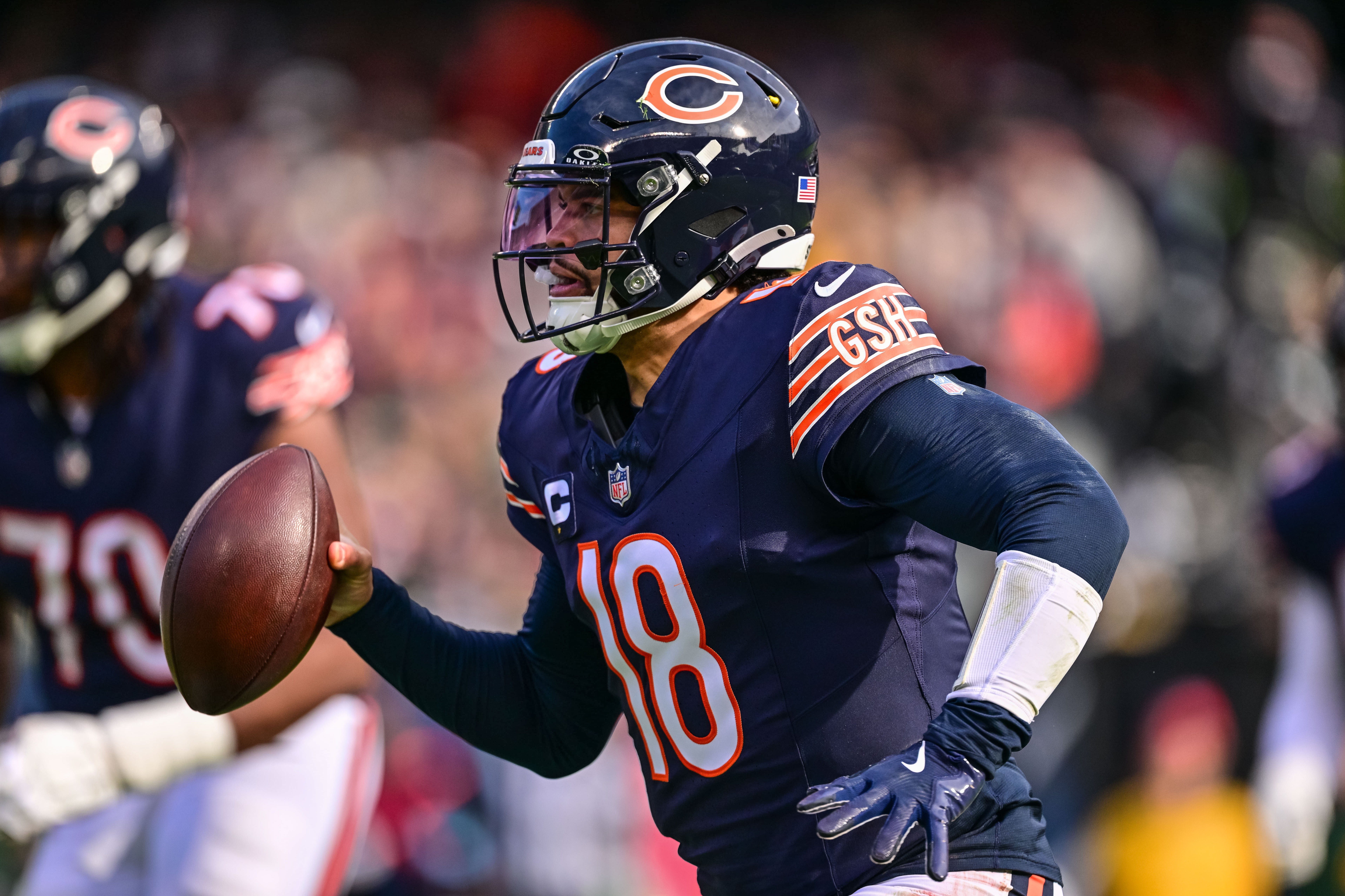 Nov 17, 2024; Chicago, Illinois, USA; Chicago Bears quarterback Caleb Williams (18) runs the ball against the Green Bay Packers during the first quarter at Soldier Field.
