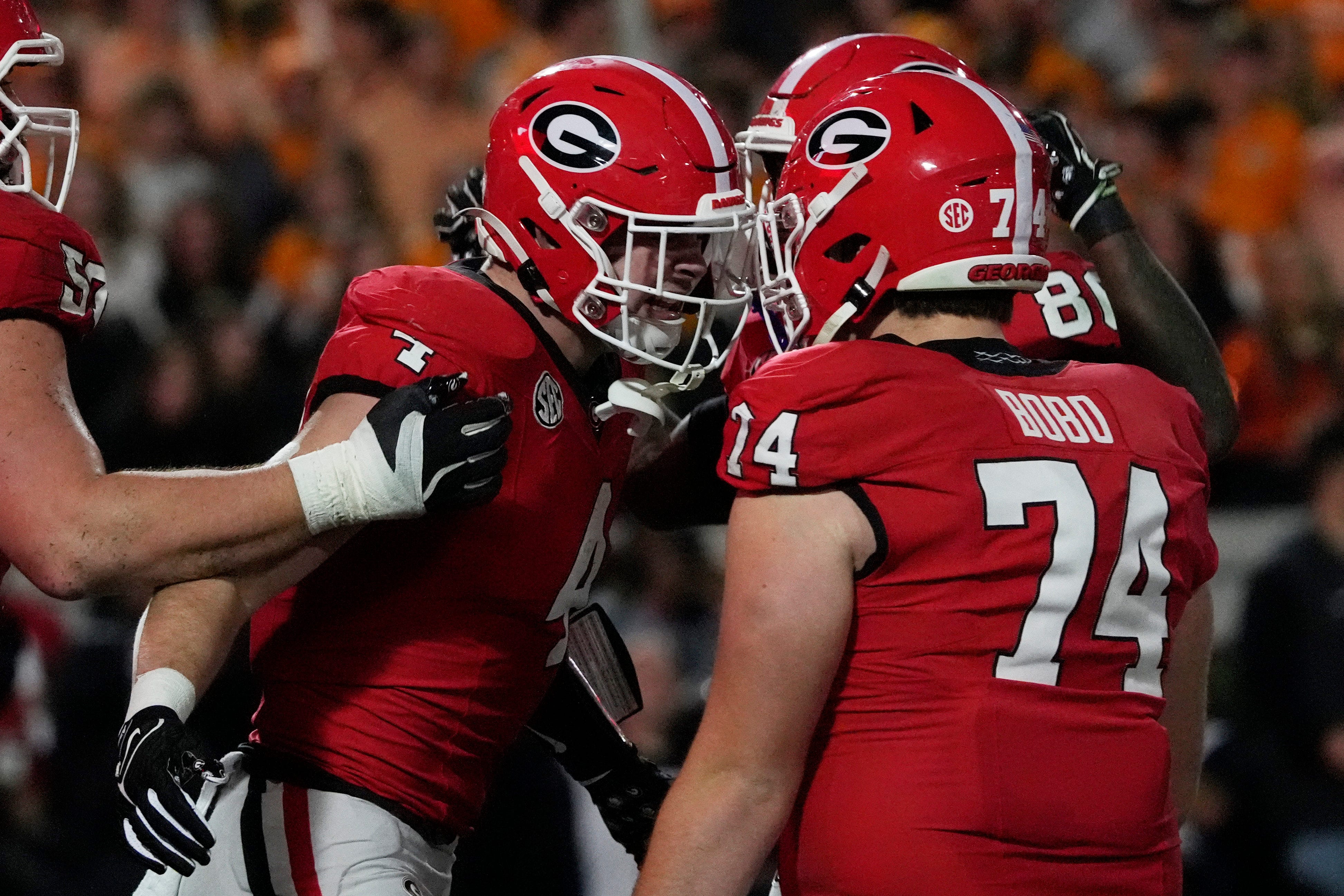 Georgia tight end Oscar Delp (4) celebrates with his teammates after scoring touchdown during the first half of a NCAA college football game against Tennessee in Athens, Ga., on Saturday, Nov. 16, 2024.