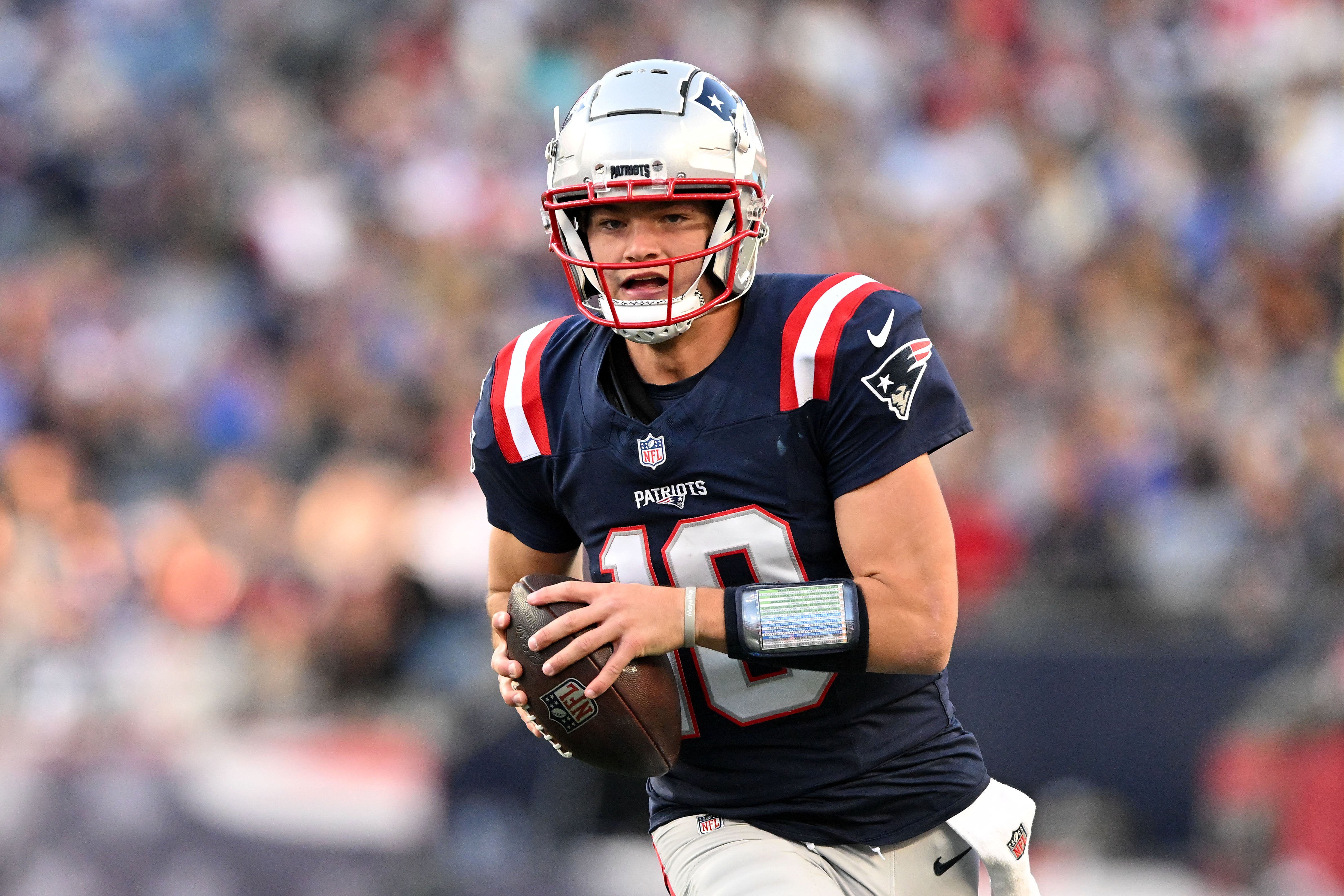 Nov 17, 2024; Foxborough, Massachusetts, USA; New England Patriots quarterback Drake Maye (10) runs with the ball against the Los Angeles Rams during the second half at Gillette Stadium.