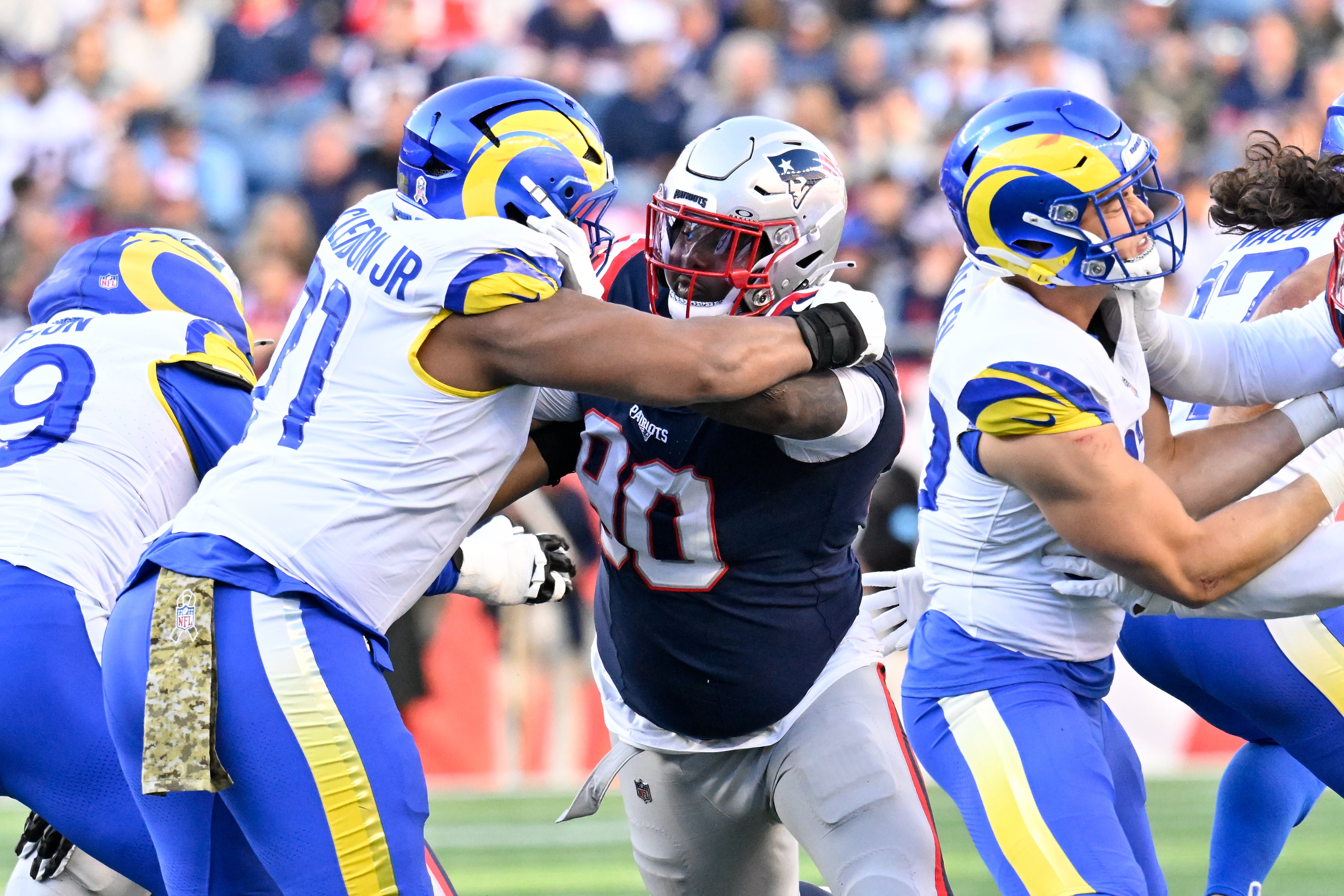 Nov 17, 2024; Foxborough, Massachusetts, USA; New England Patriots defensive tackle Christian Barmore (90) blocks Los Angeles Rams offensive tackle Warren McClendon Jr. (71) during the first half at Gillette Stadium.