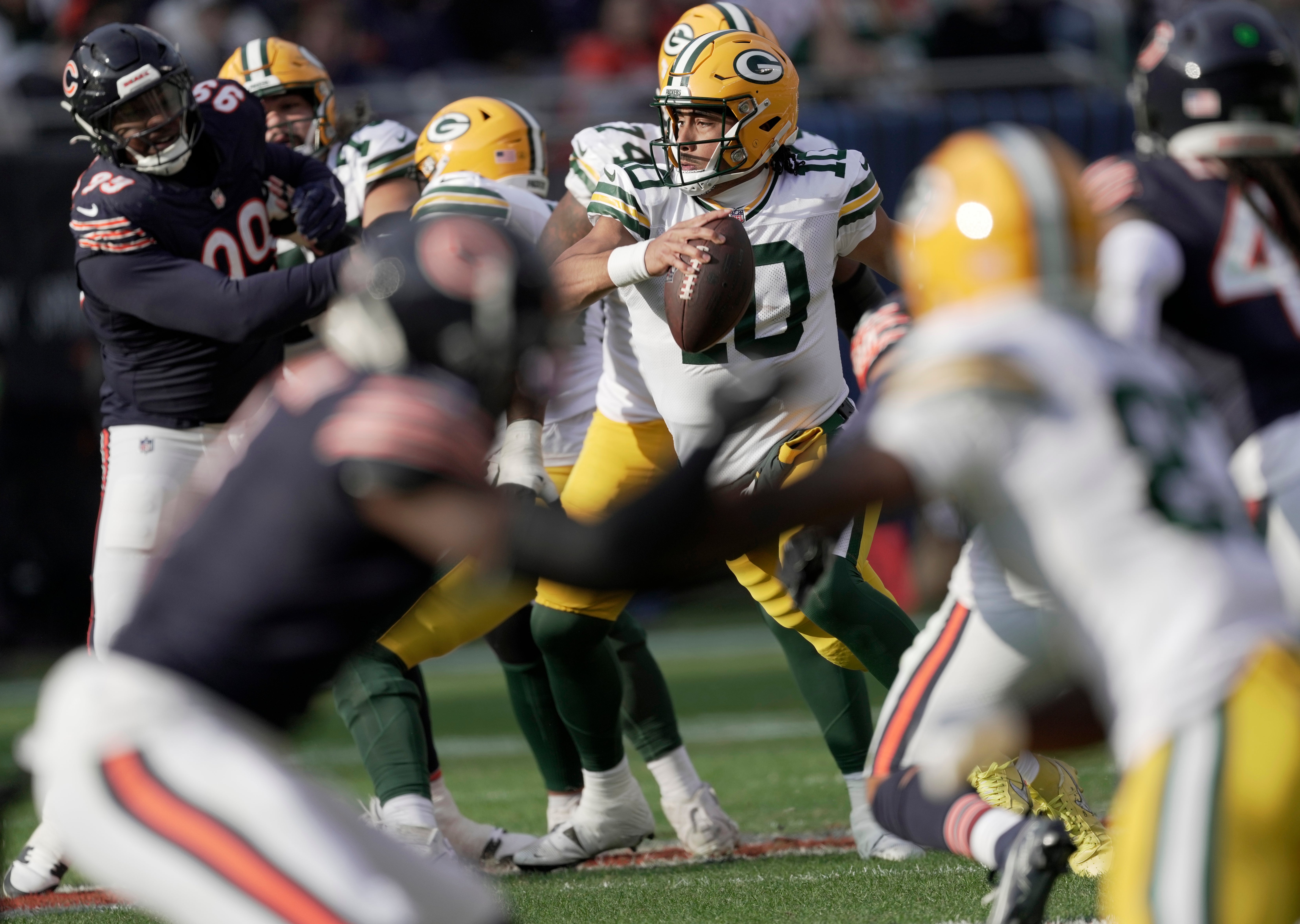 Green Bay Packers quarterback Jordan Love (10) runs for a first down during the third quarter of their game Sunday, November 17, 2024 at Soldier Field in Chicago, Illinois. The Green Bay Packers beat the Chicago Bears 20-19.