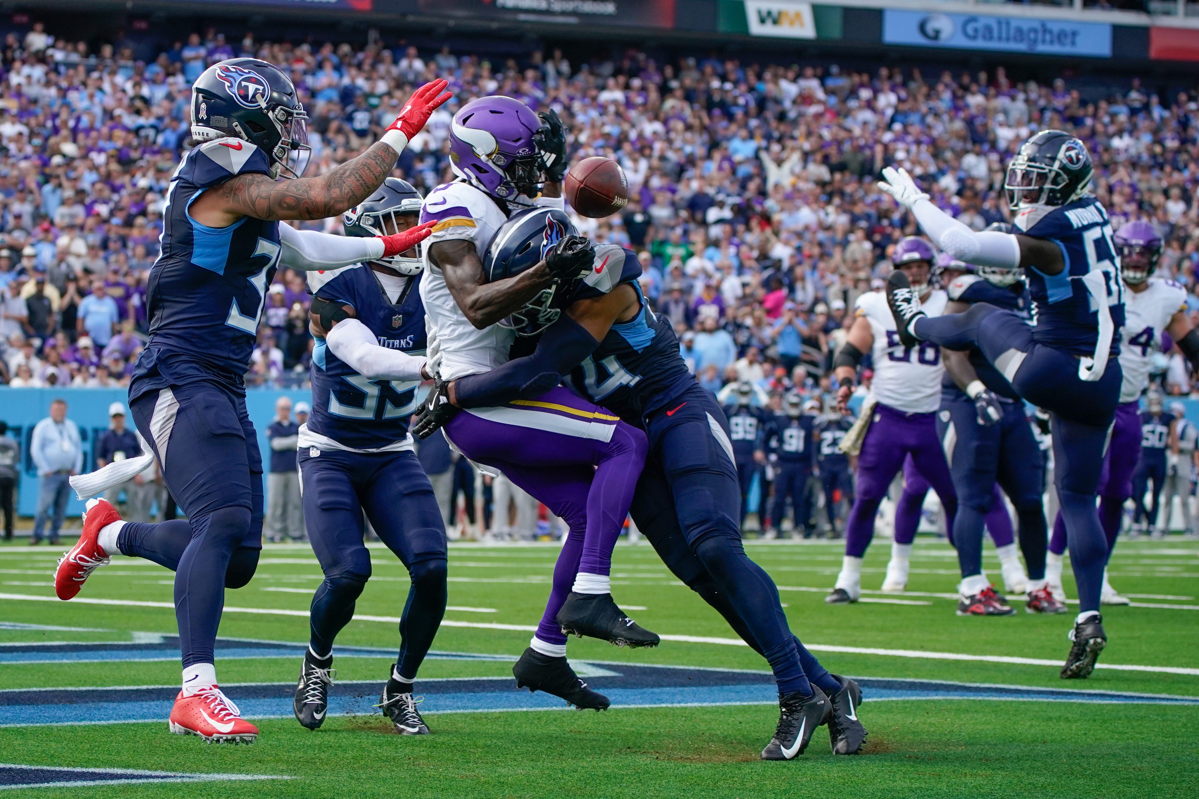 Tennessee Titans safety Mike Brown (44) breaks up a pass intended for Minnesota Vikings wide receiver Jordan Addison (3) during the second quarter at Nissan Stadium in Nashville, Tenn., Sunday, Nov. 17, 2024.
