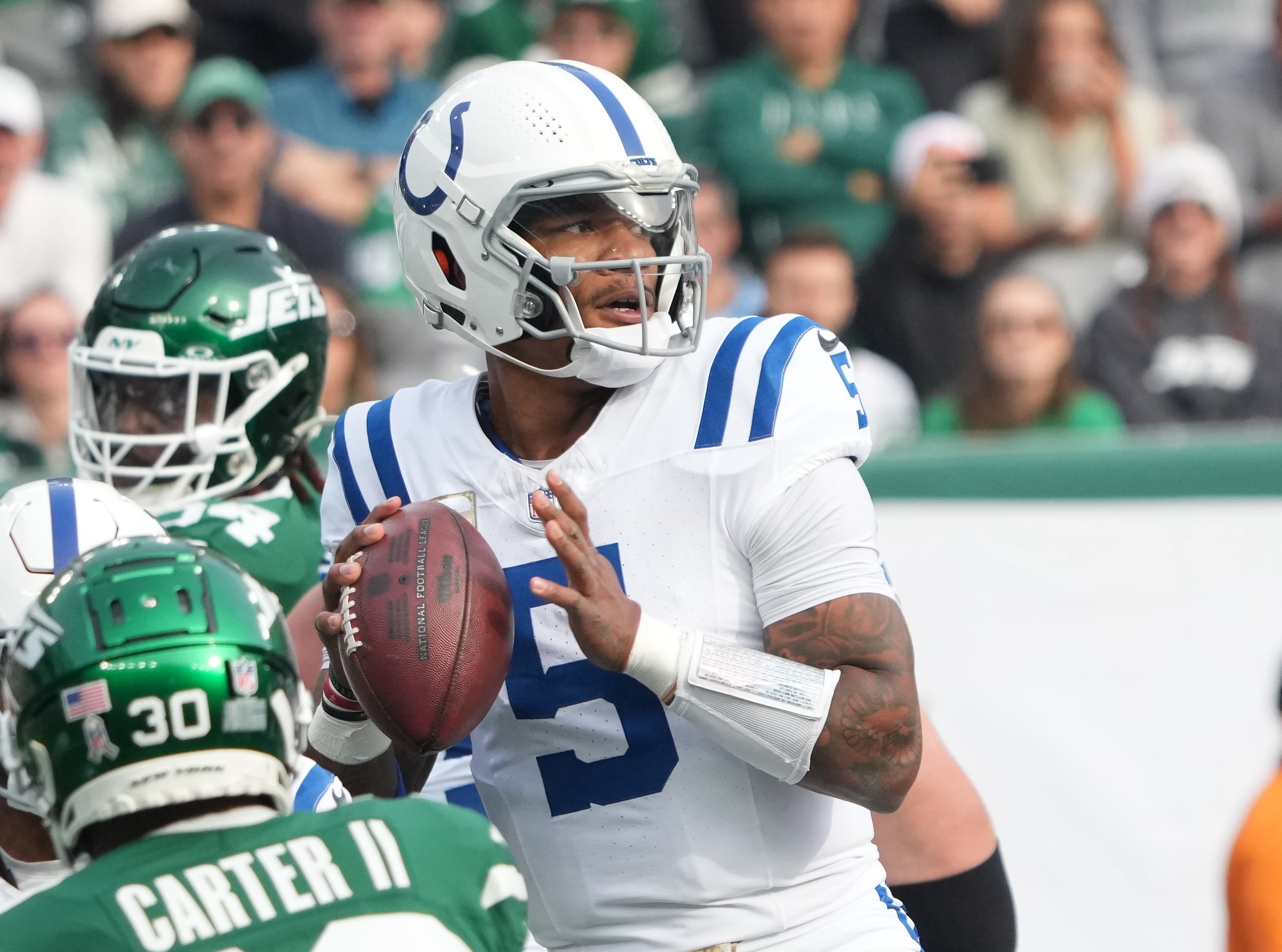 Nov 17, 2024; East Rutherford, New Jersey, USA; Indianapolis Colts quarterback Anthony Richardson (5) looks to pass against the New York Jets during the first quarter at MetLife Stadium.