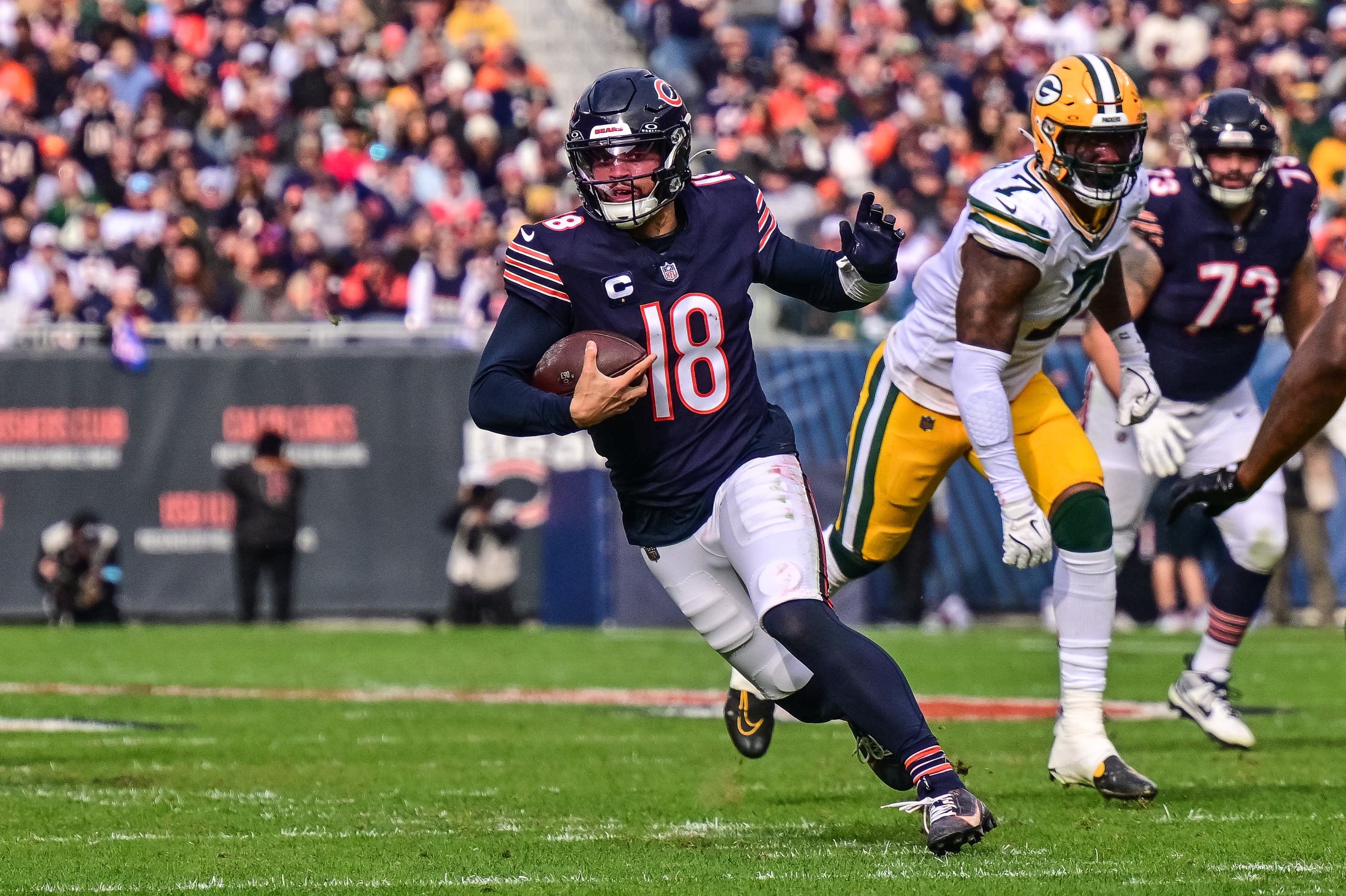 Nov 17, 2024; Chicago, Illinois, USA; Chicago Bears quarterback Caleb Williams (18) runs the ball against the Green Bay Packers during the second quarter at Soldier Field.
