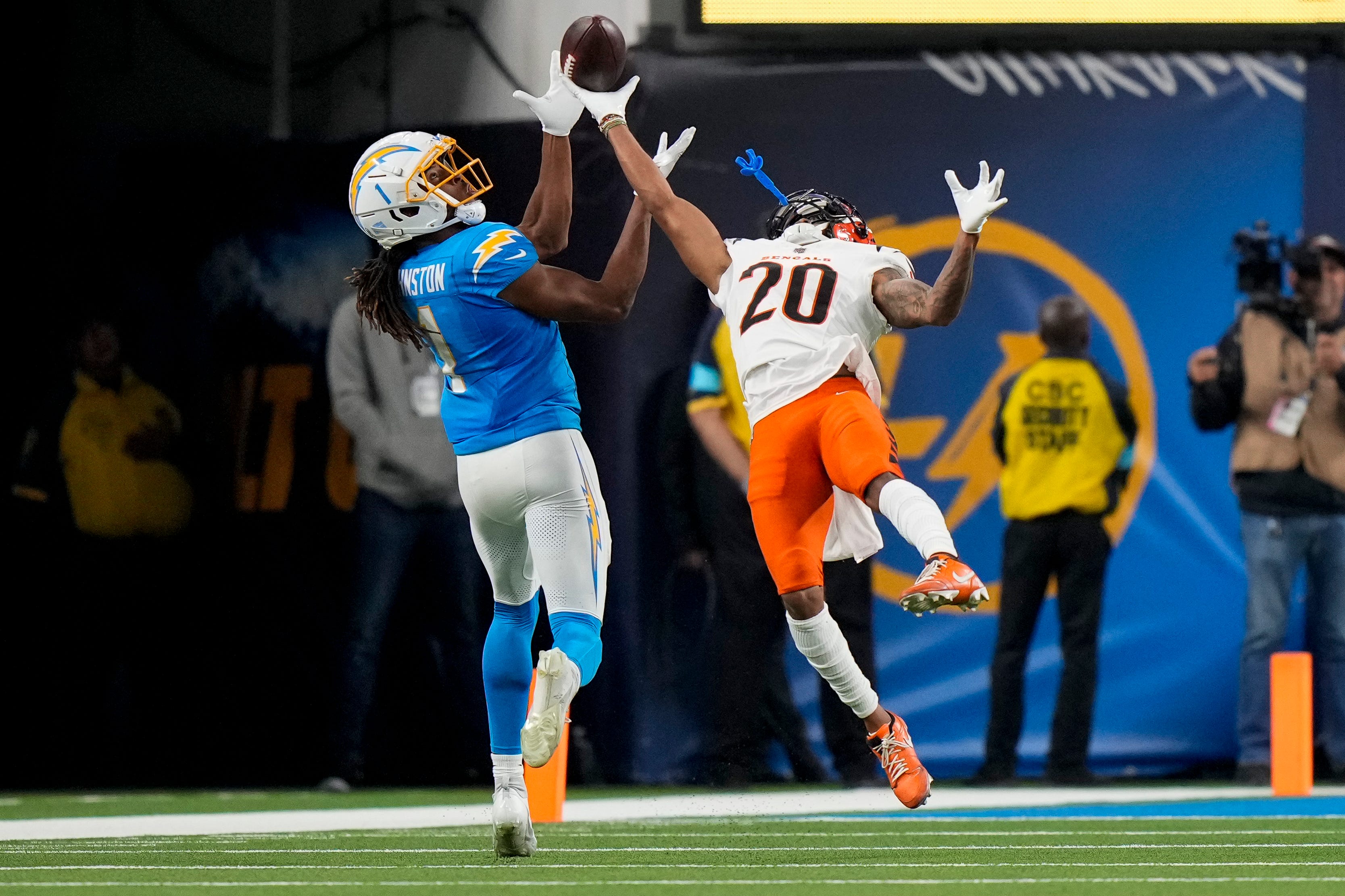 Cincinnati Bengals cornerback DJ Turner II (20) breaks up a deep pass intended for Los Angeles Chargers wide receiver Quentin Johnston (1) in the third quarter of the NFL Week 11 game between the Los Angeles Chargers and the Cincinnati Bengals at SoFi Stadium in Inglewood, Calif., on Sunday, Nov. 17, 2024. The Chargers won 34-27.