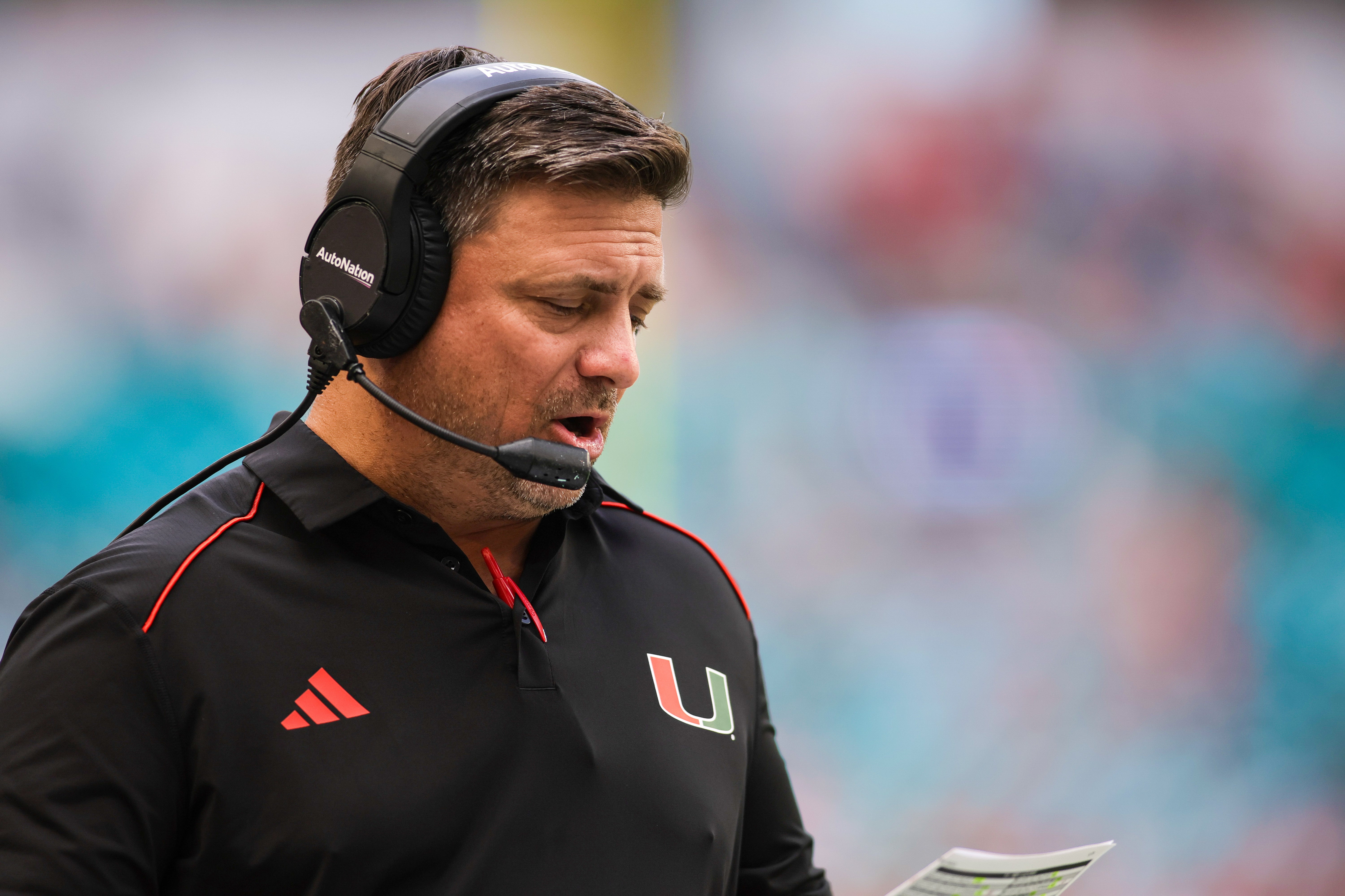 Oct 28, 2023; Miami Gardens, Florida, USA; Miami Hurricanes offensive coordinator Shannon Dawson coaches from the sideline prior to the game against the Virginia Cavaliers at Hard Rock Stadium.