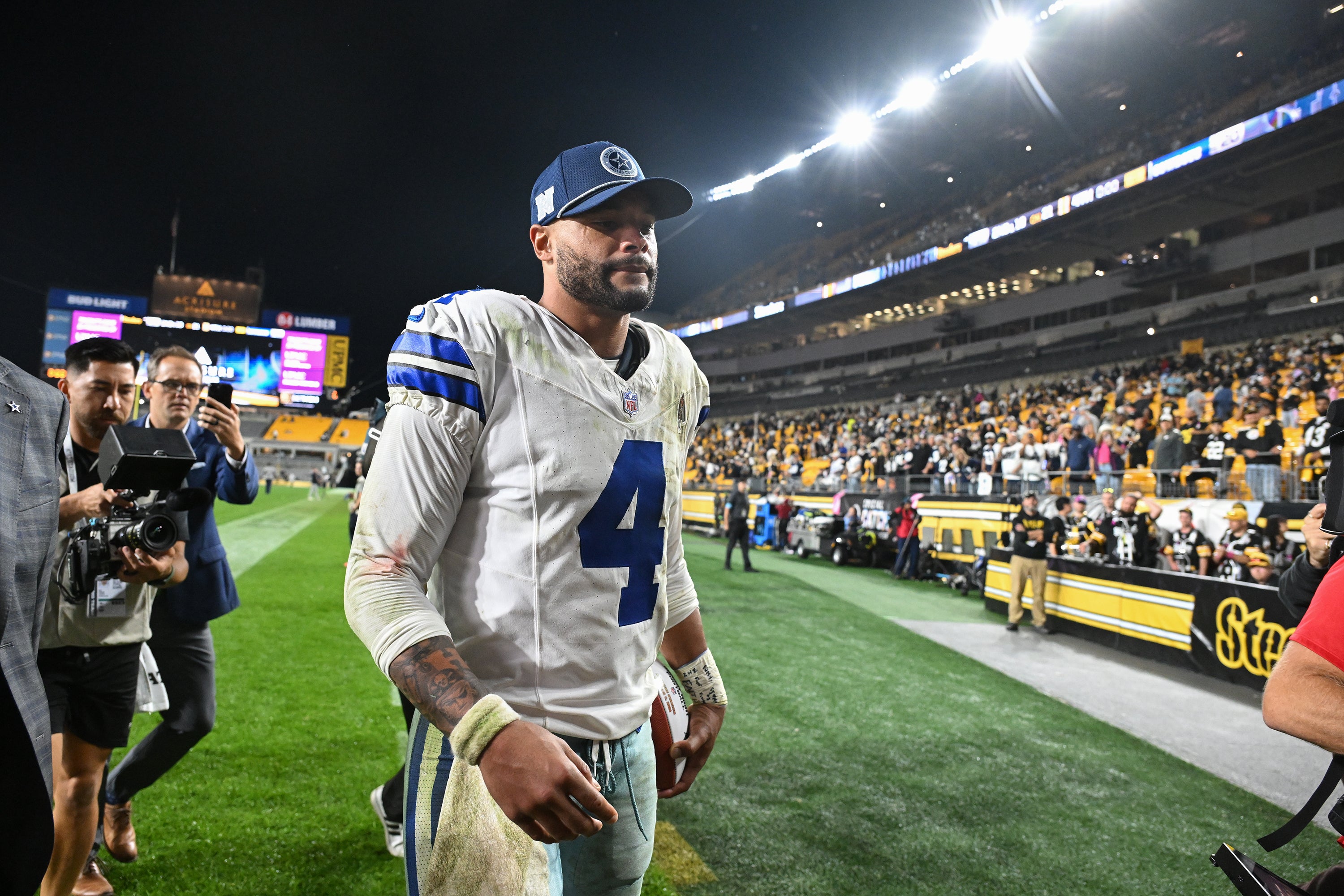 Dallas Cowboys quarterback Dak Prescott (4) leaves the field after a 20-17 win against the Pittsburgh Steelers at Acrisure Stadium.