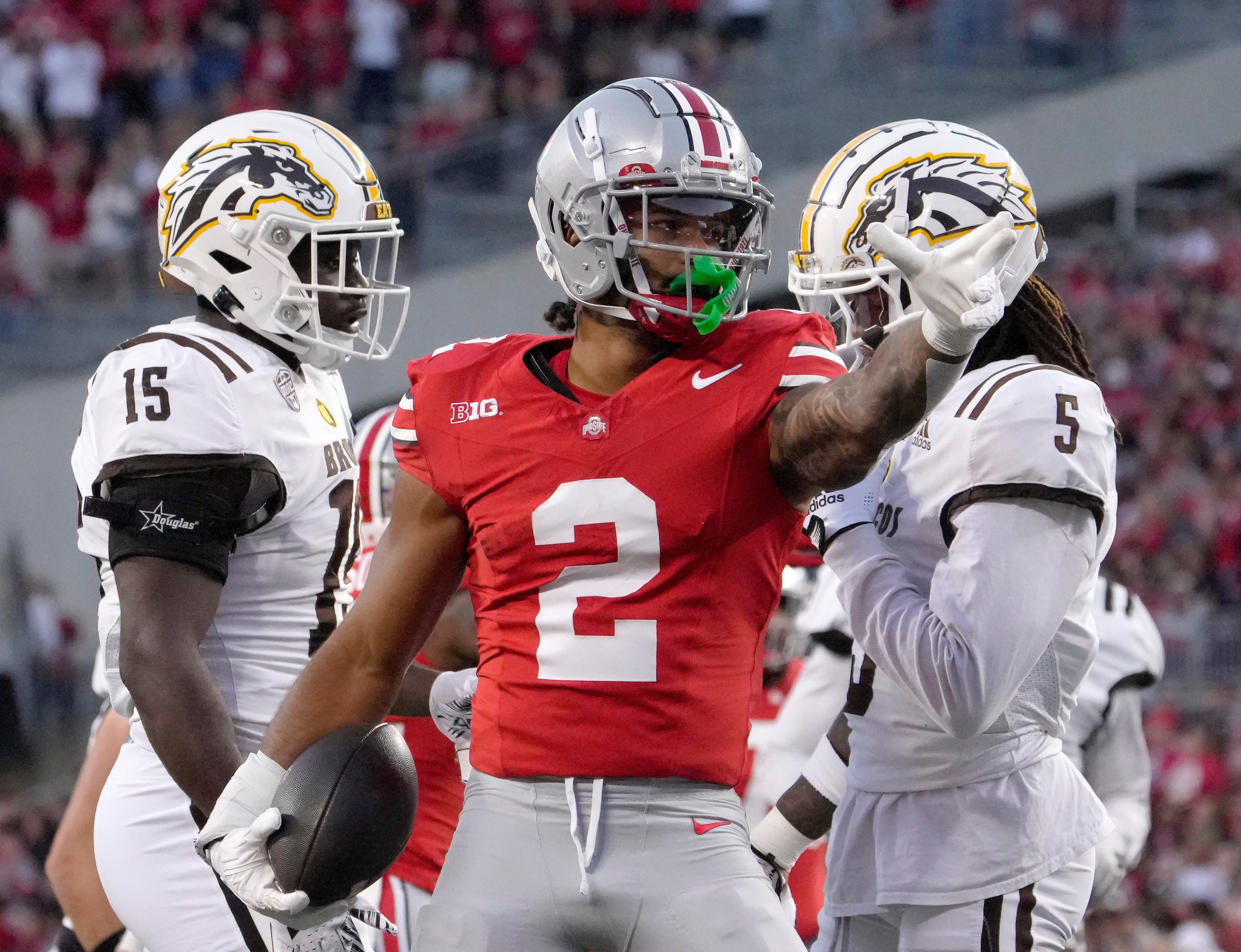 Ohio State Buckeyes wide receiver Emeka Egbuka (2) signals for a first down against the Western Michigan Broncos during the first half at Ohio Stadium.