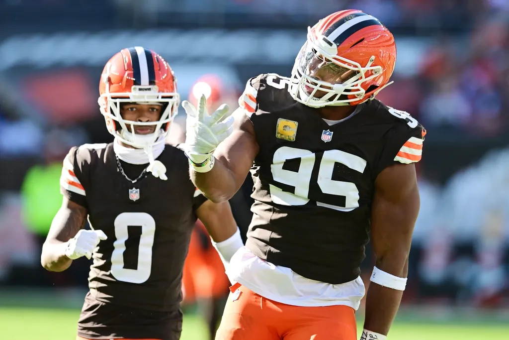 Cleveland Browns defensive end Myles Garrett (95) celebrates after sacking Los Angeles Chargers quarterback Justin Herbert (not pictured) for the third time during the first half at Huntington Bank Field