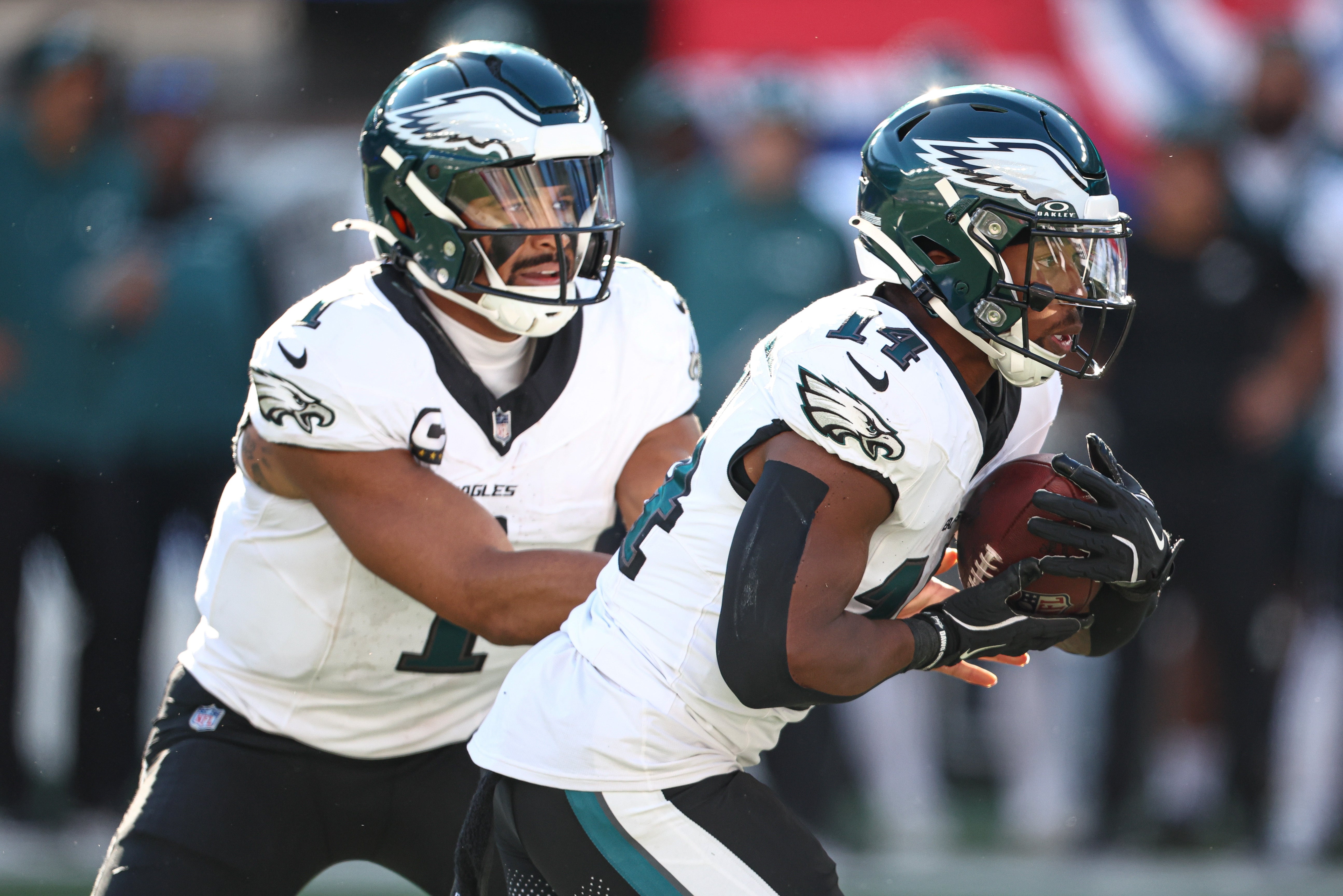 Philadelphia Eagles quarterback Jalen Hurts (1) hands off to running back Kenneth Gainwell (14) during the second half against the New York Giants at MetLife Stadium.