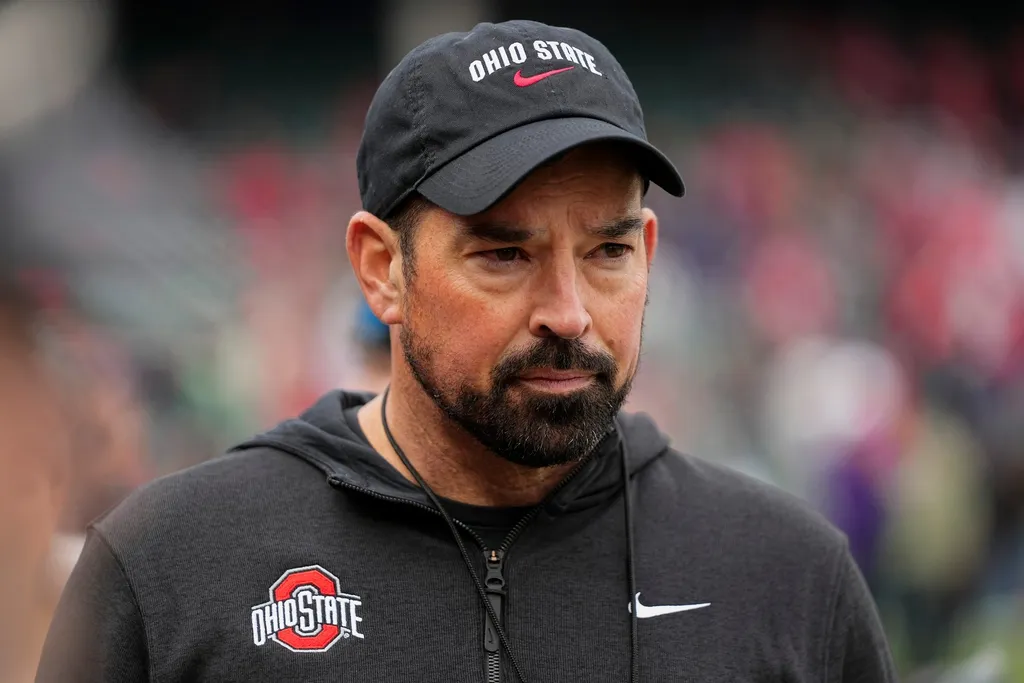 Ohio State Buckeyes head coach Ryan Day watches warm ups prior to the NCAA football game against the Northwestern Wildcats at Wrigley Field in Chicago on Monday, Nov. 18, 2024. Ohio State won 31-7