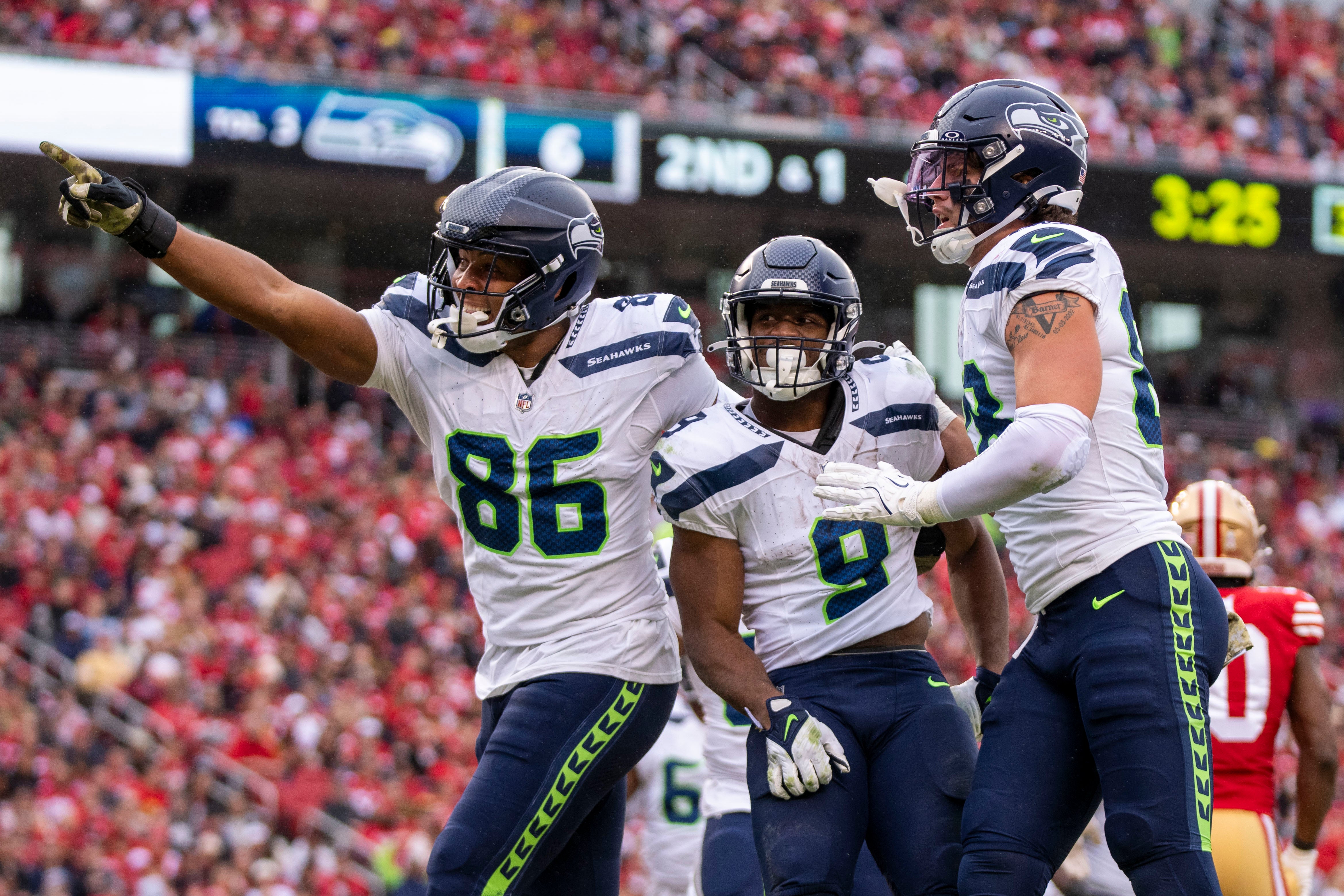 November 17, 2024; Santa Clara, California, USA; Seattle Seahawks running back Kenneth Walker III (9) is congratulated by tight end Pharaoh Brown (86) and tight end AJ Barner (88) for scoring a touchdown against the San Francisco 49ers during the third quarter at Levi's Stadium.