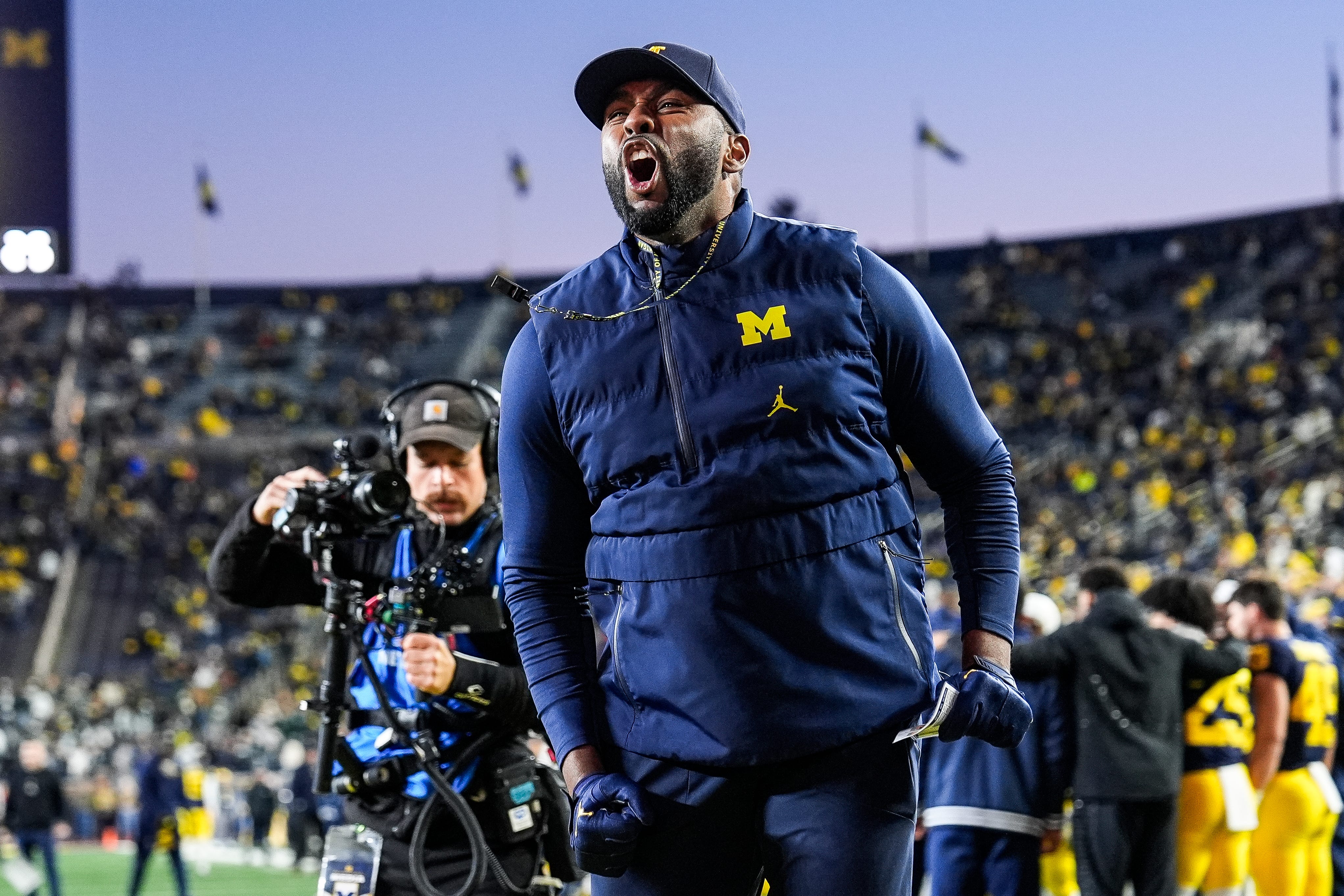 Michigan head coach Sherrone Moore cheers up fans before the Michigan State game at Michigan Stadium in Ann Arbor on Saturday, Oct. 26, 2024.