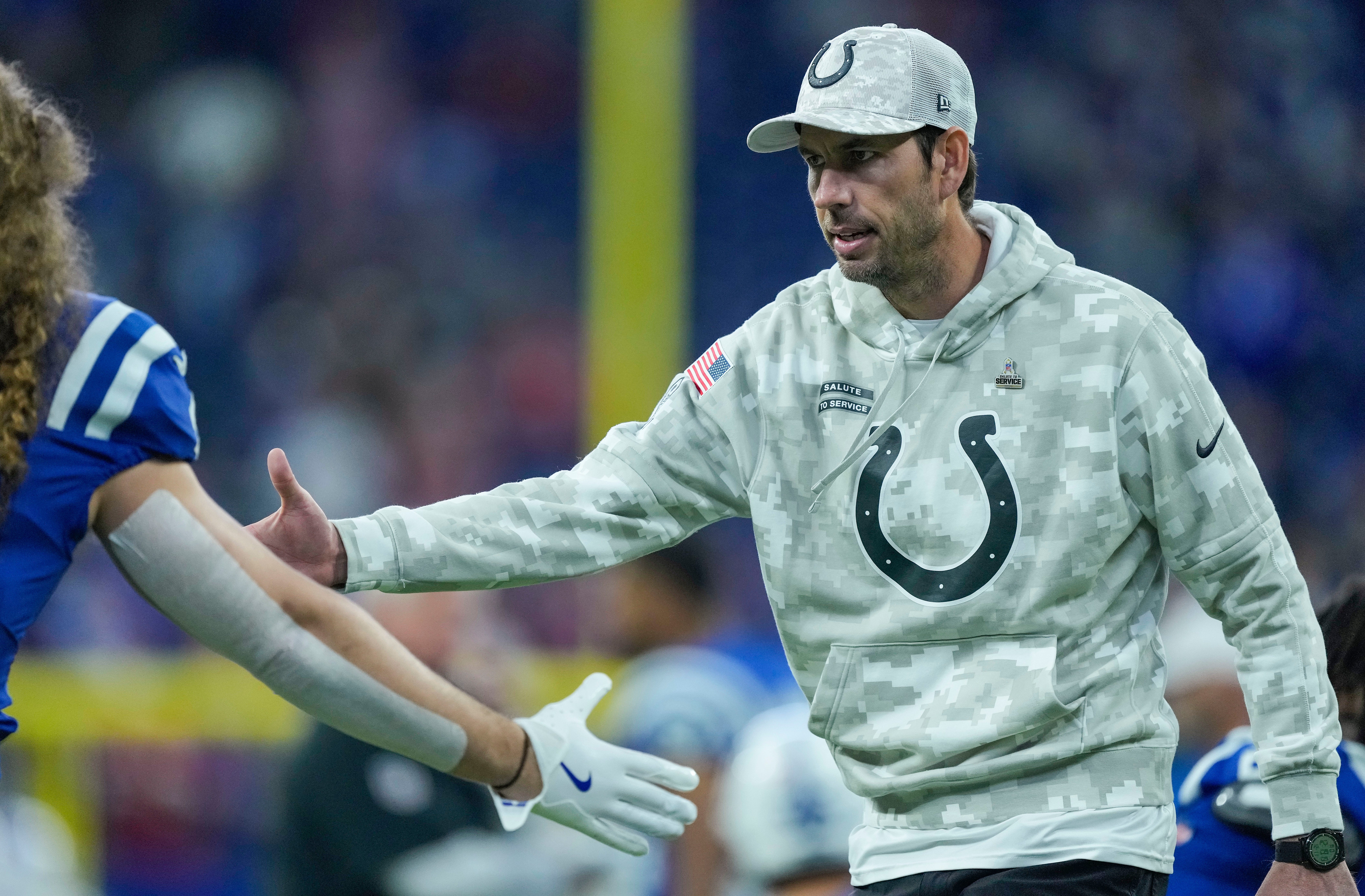 Indianapolis Colts Shane Steichen high-fives Indianapolis Colts linebacker Grant Stuard (41) during pregame warm-up Sunday, Nov. 10, 2024, ahead of a game against the Buffalo Bills at Lucas Oil Stadium in Indianapolis.