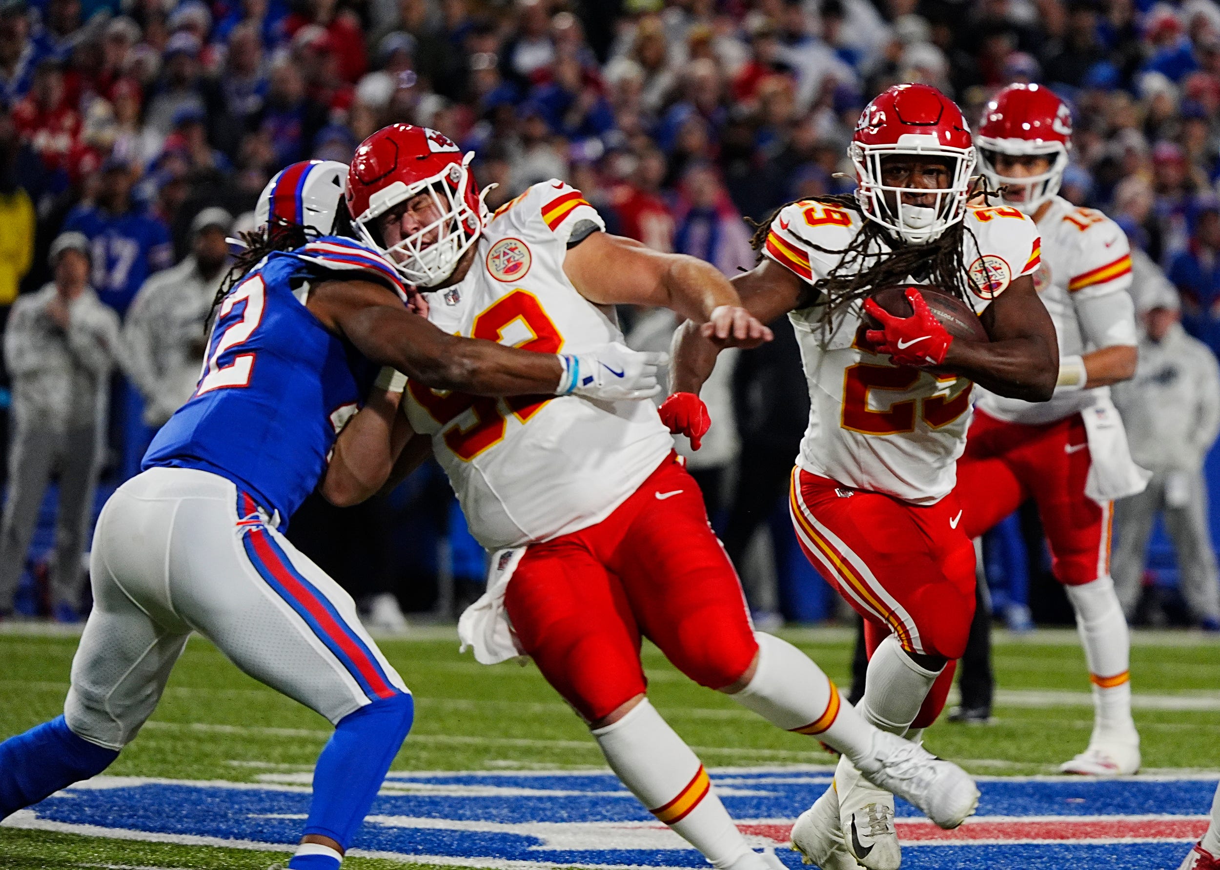 Bills Dorian Williams gets blocked by Kansas City's Marlon Tuipulotu as Williams tries to get to Kansas City's running back Kareem Hunt during first half action against the Kansas City Chiefs in Orchard Park, Nov.17, 2024.