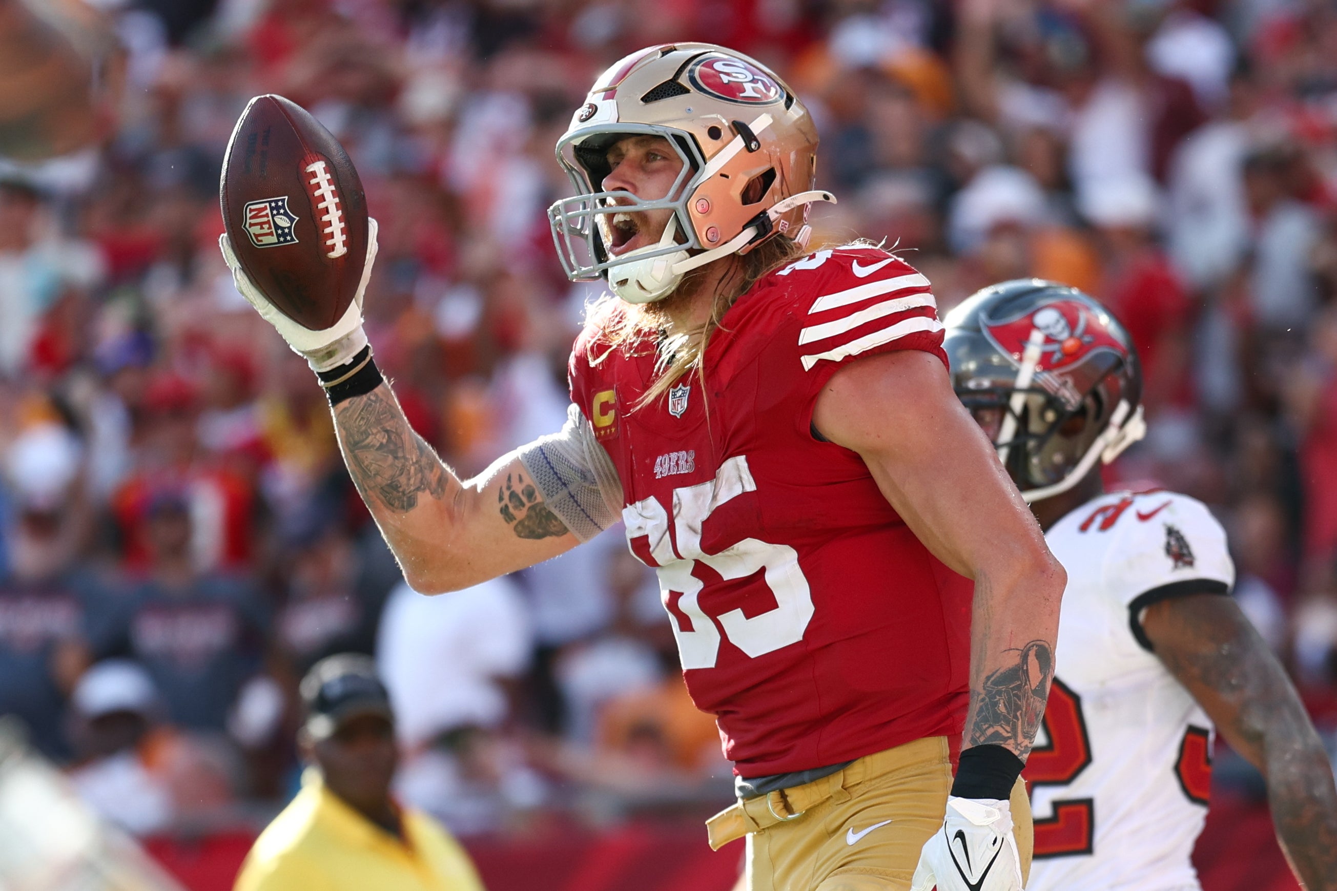 San Francisco 49ers tight end George Kittle (85) celebrates after scoring a touchdown against the Tampa Bay Buccaneers in the fourth quarter at Raymond James Stadium.