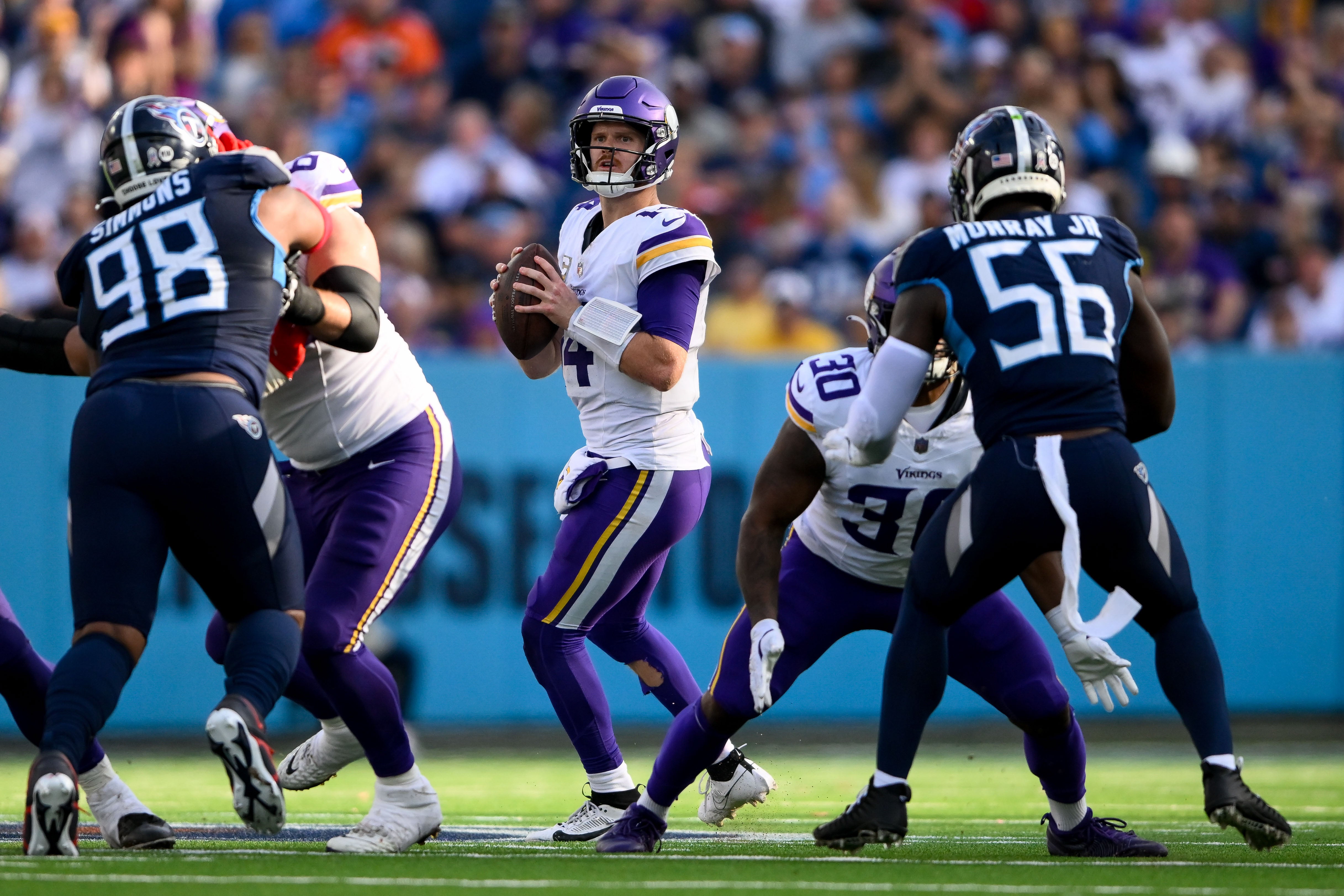 Nov 17, 2024; Nashville, Tennessee, USA; Minnesota Vikings quarterback Sam Darnold (14) stands in the pocket against the Tennessee Titans during the second half at Nissan Stadium.