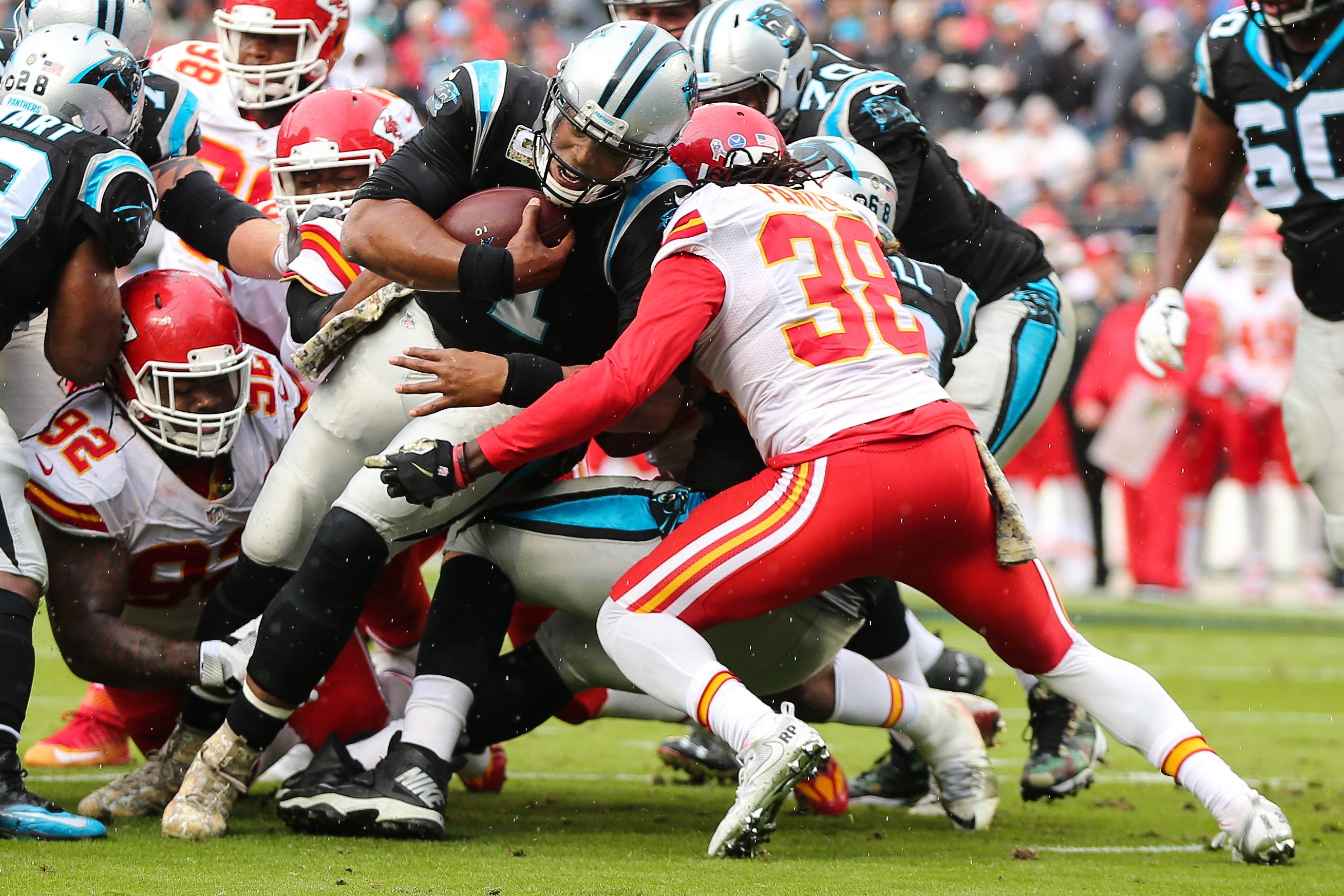 Nov 13, 2016; Charlotte, NC, USA; Carolina Panthers quarterback Cam Newton (1) runs in for a score over Kansas City Chiefs free safety Ron Parker (38) during the game at Bank of America Stadium. The Chiefs win 20-17 over the Panthers.