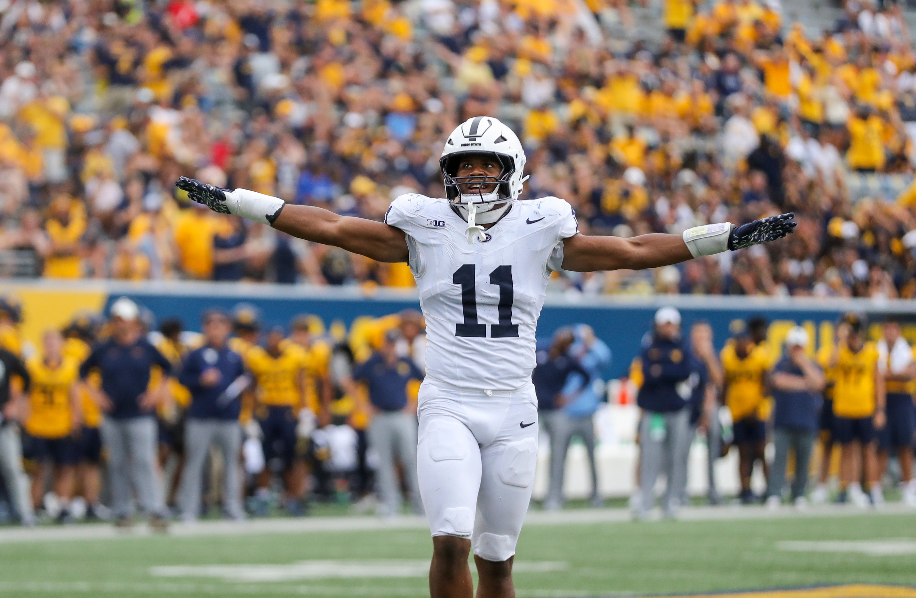 Aug 31, 2024; Morgantown, West Virginia, USA; Penn State Nittany Lions defensive end Abdul Carter (11) celebrates after a defensive stop during the fourth quarter against the West Virginia Mountaineers at Mountaineer Field at Milan Puskar Stadium.