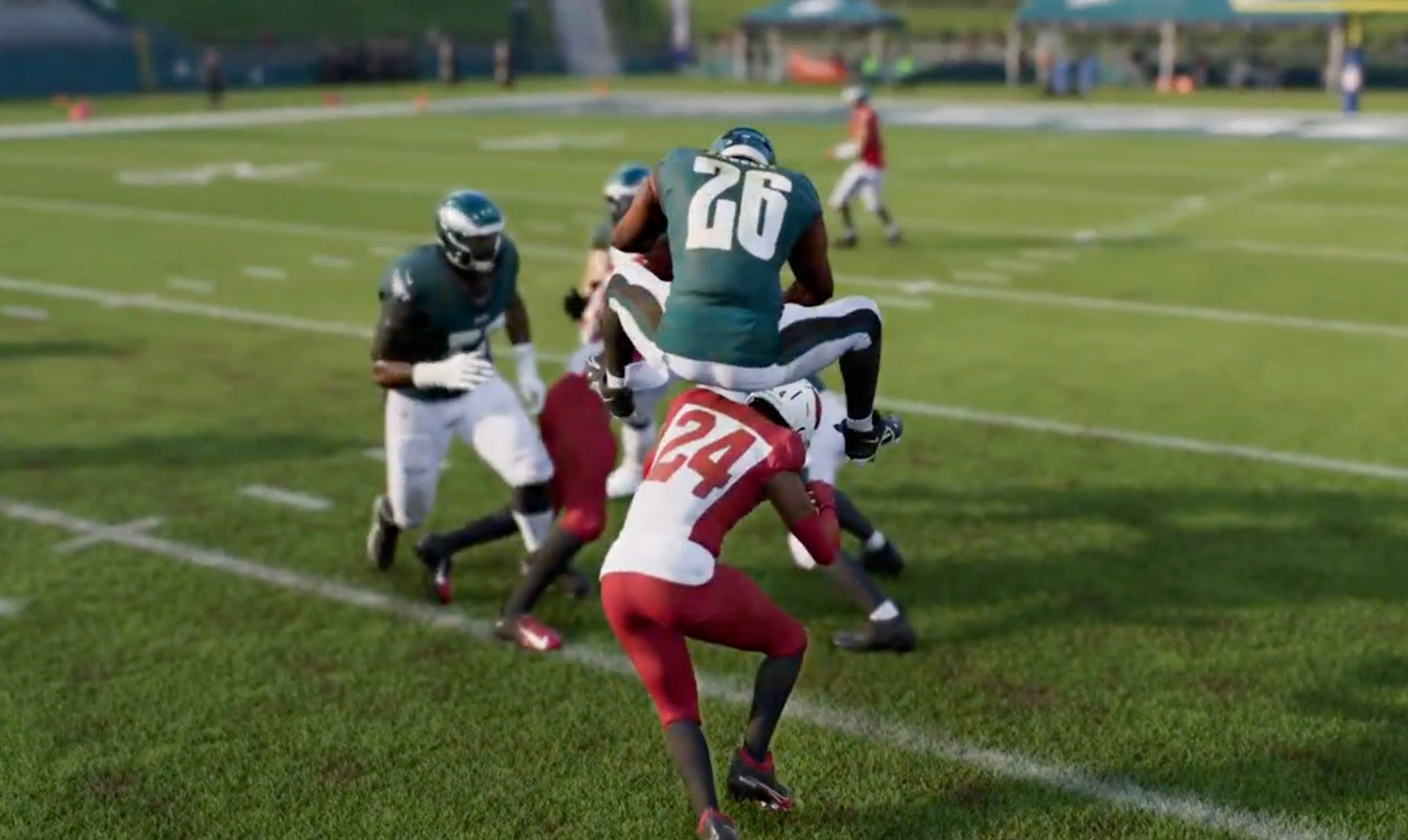 Saquon Barkley doing his new signature reverse hurdle move in Madden NFL 25.