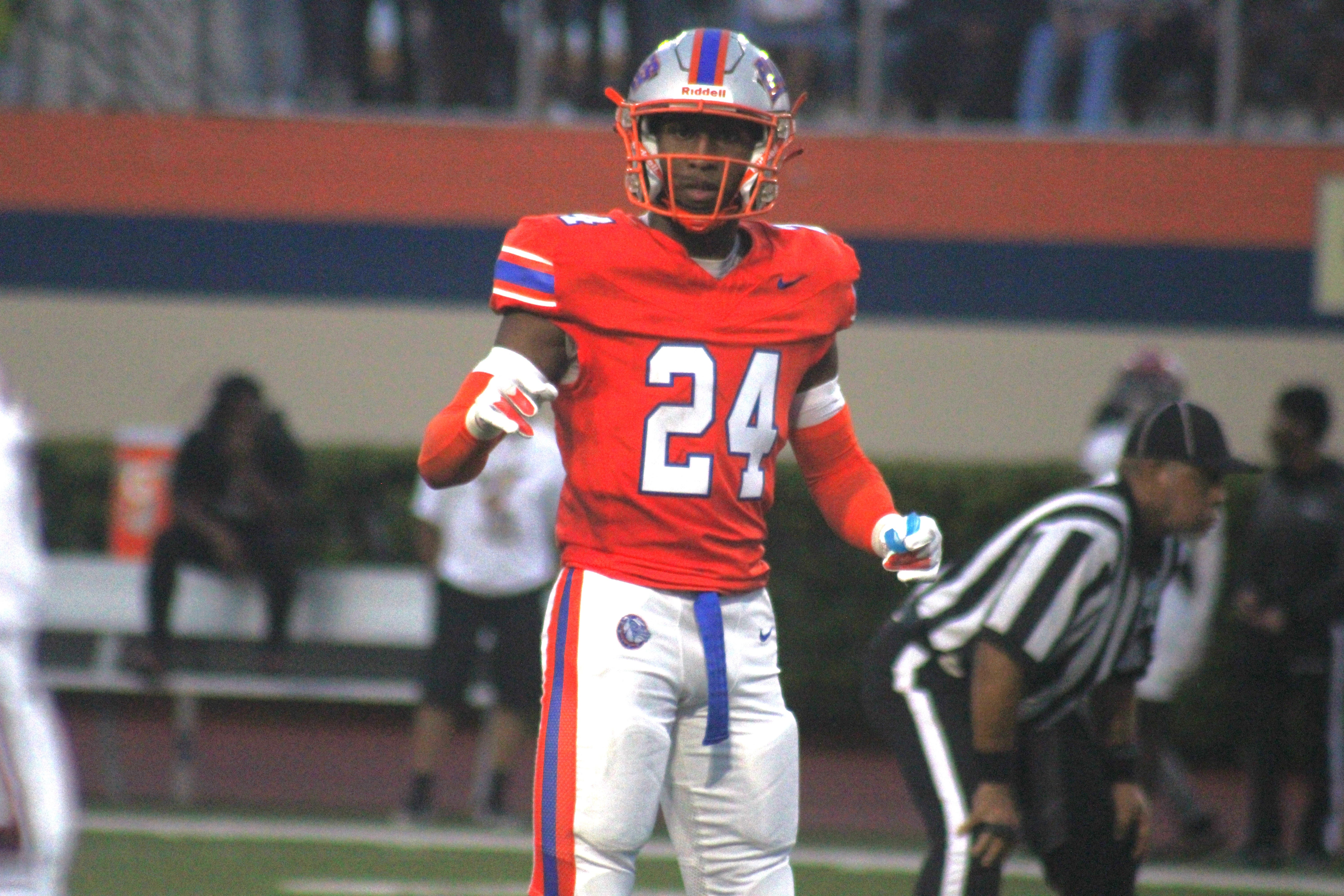 Bolles linebacker/safety Simeon Caldwell looks toward the sideline for a signal during a high school football game against Raines on August 23, 2024.