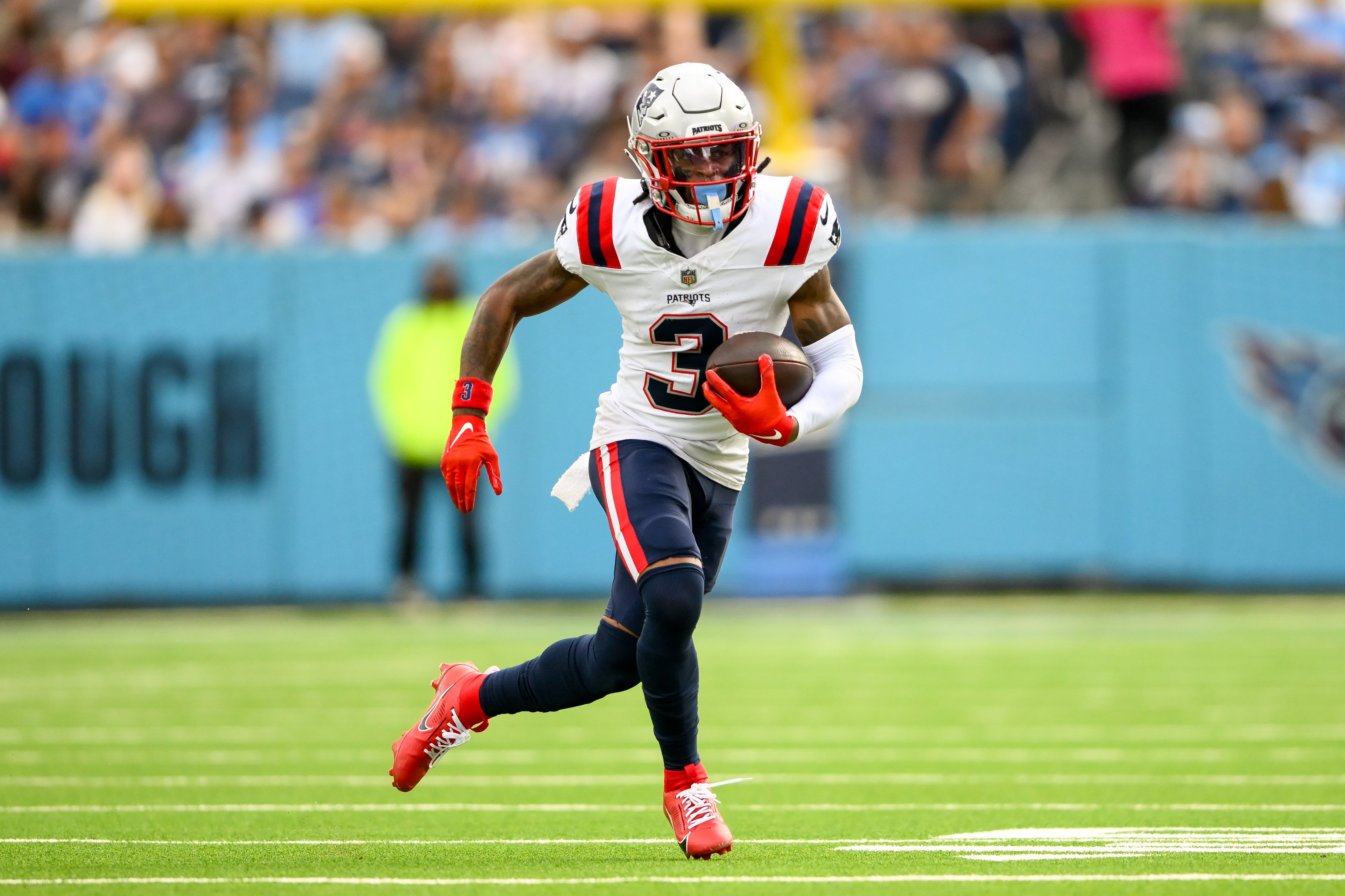Nov 3, 2024; Nashville, Tennessee, USA; New England Patriots wide receiver DeMario Douglas (3) runs the ball against the Tennessee Titans during the first half at Nissan Stadium.