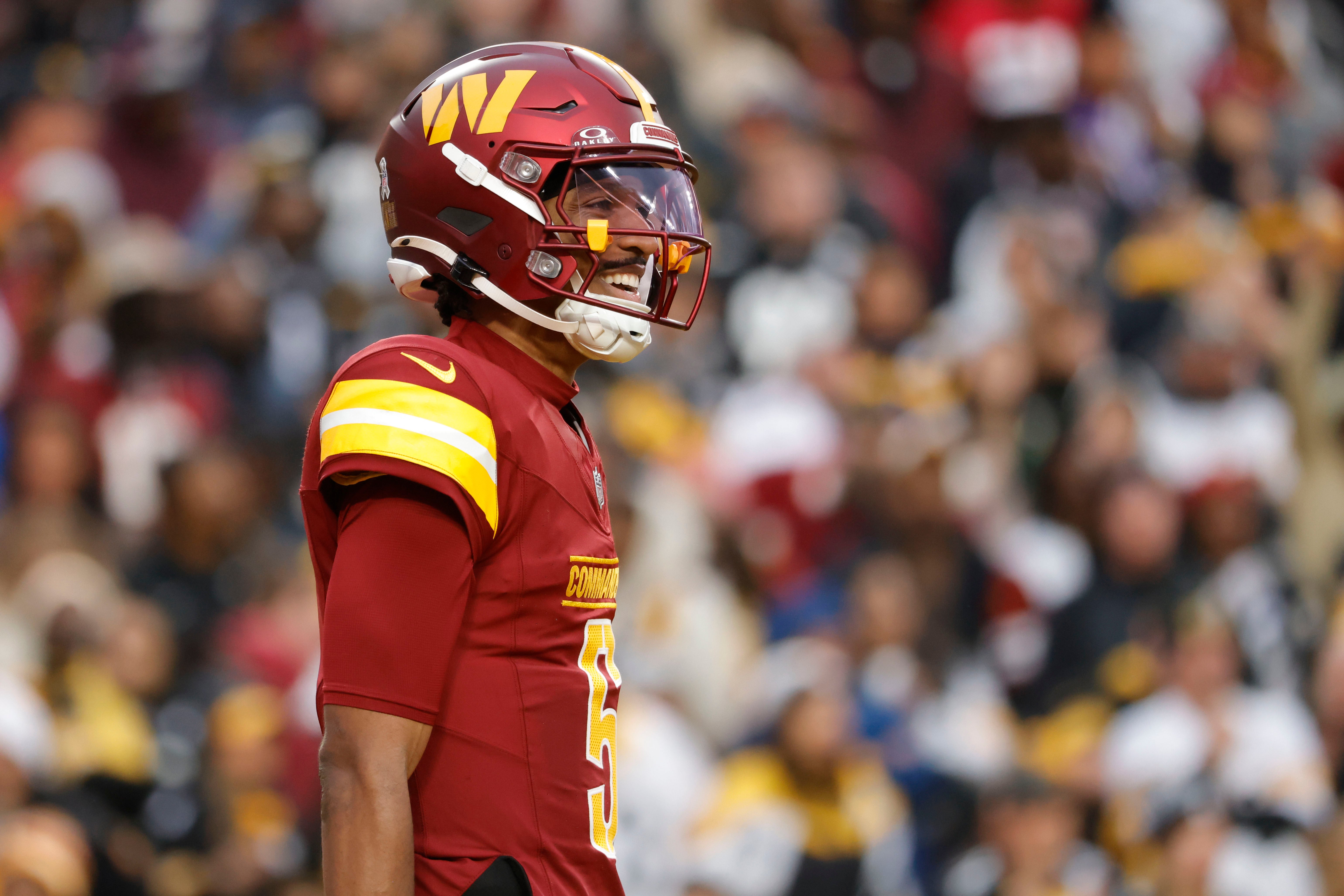 Nov 10, 2024; Landover, Maryland, USA; Washington Commanders quarterback Jayden Daniels (5) reacts after a play against the Pittsburgh Steelers during the second half at Northwest Stadium.
