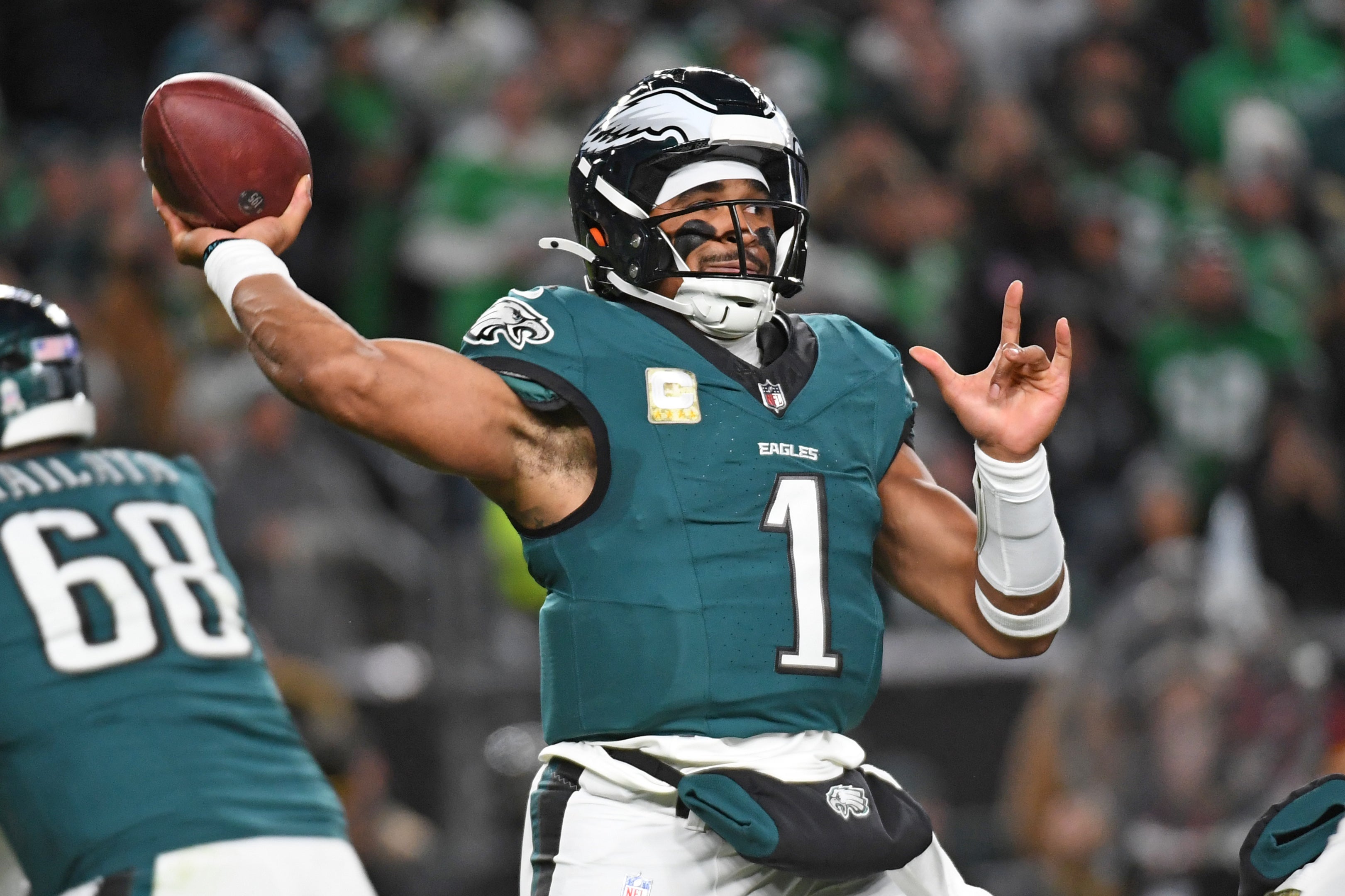 Philadelphia Eagles quarterback Jalen Hurts (1) throws a pass against the Washington Commanders during the first quarter at Lincoln Financial Field.